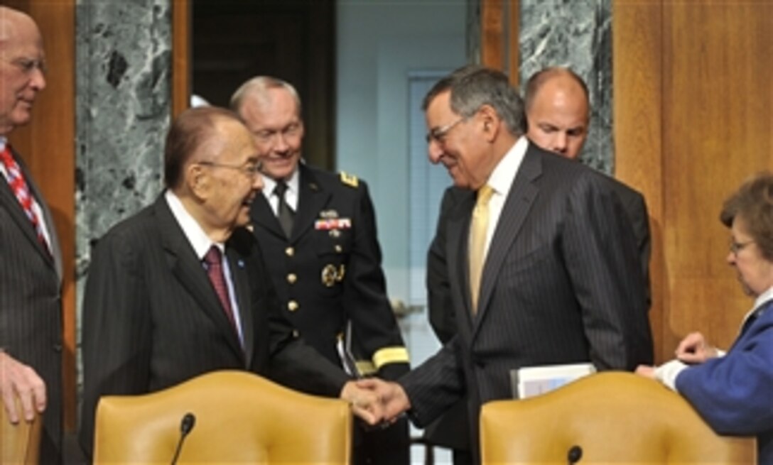 Chairman of the U.S. Senate Appropriations Subcommittee on Defense Senator Daniel Inouye greets Secretary of Defense Leon E. Panetta shortly before his testimony on the fiscal year 2013 budget at the Dirksen Senate Office Building, Washington, D.C., on June 13, 2012.  