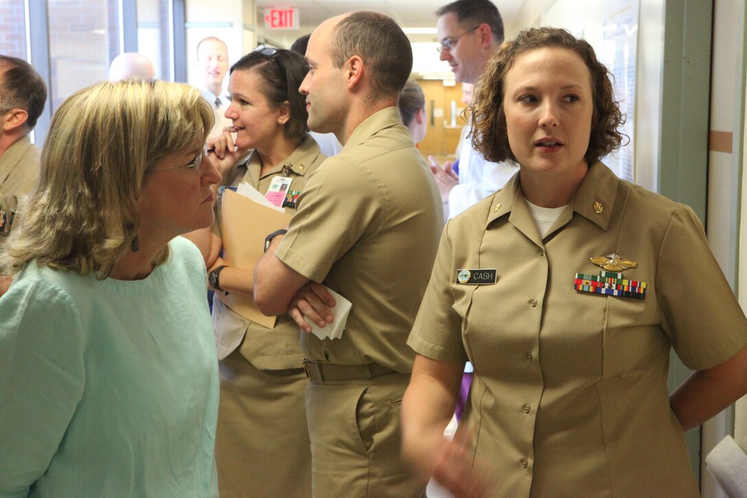 A Family Medicine resident explains her research during Naval Hospital Camp Lejeune’s second annual Research Symposium aboard Marine Corps Base Camp Lejeune June 8. Residents had been doing research and testing for as much as two years and presented their findings at the symposium.