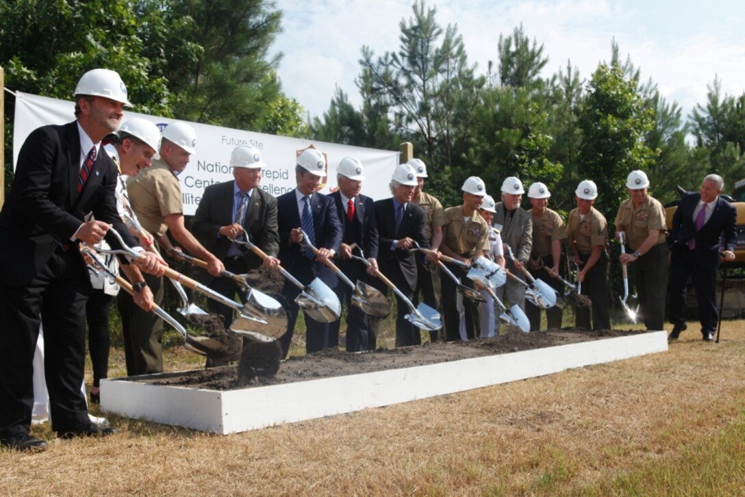 The ceremonial dig for the National Intrepid Center of Excellence Satellite Center Camp Lejeune occurred aboard Marine Corps Base Camp Lejeune June 13. The new center will be dedicated to the research and treatment of traumatic brain injury and post-traumatic stress.