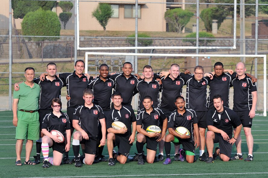 The Osan Exiles rugby team poses for a team photo prior to their practice at Osan Air Base, Republic of Korea, June 14, 2012. The Exiles compete in the U.S. Forces Korea rugby league with members from all branches of the military. (U.S. Air Force photo/Staff Sgt. Craig Cisek)