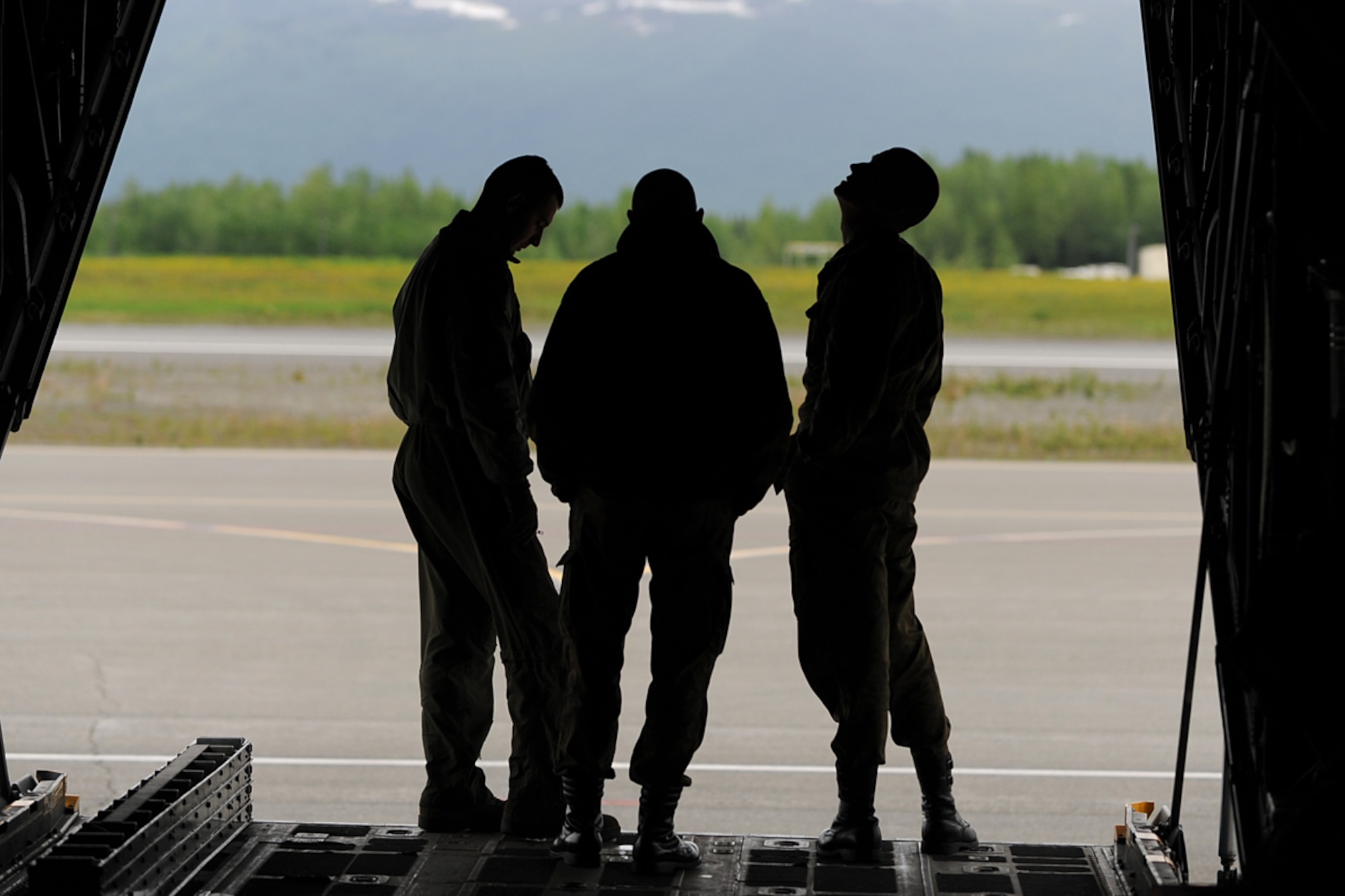 Members of the Polish Air Force C-130 Hercules crew inspect the aircraft during Red Flag-Alaska on Joint Base Elmendorf-Richardson June 13, 2012. The goal of Red Flag-Alaska is to provide each aircrew with vital first missions to increase their chances of survival in combat environments. (U.S. Air Force photo/Airman 1st Class Austin Willhoit)