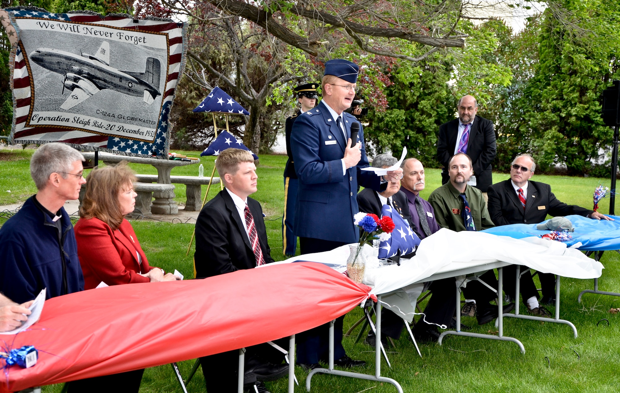 Col. Thomas F. Roshetko, 92nd Medical Group commander, addresses an audience of Korean War veterans, families and friends and community members who honored 87 “Forgotten Heroes” of a tragic 1952 Air Force C-124A Globemaster crash during a memorial dedication ceremony at the Grant County International Airport in Moses Lake, Wash., June 9, 2012. The personnel transport took off Dec. 20, 1952, from what was then Larson Air Force Base as part of a continuation trip from Korea called “Operation Sleighride,” bringing servicemembers home for the holidays. (U.S. Air Force photo by Senior Airman Benjamin Stratton/Released)