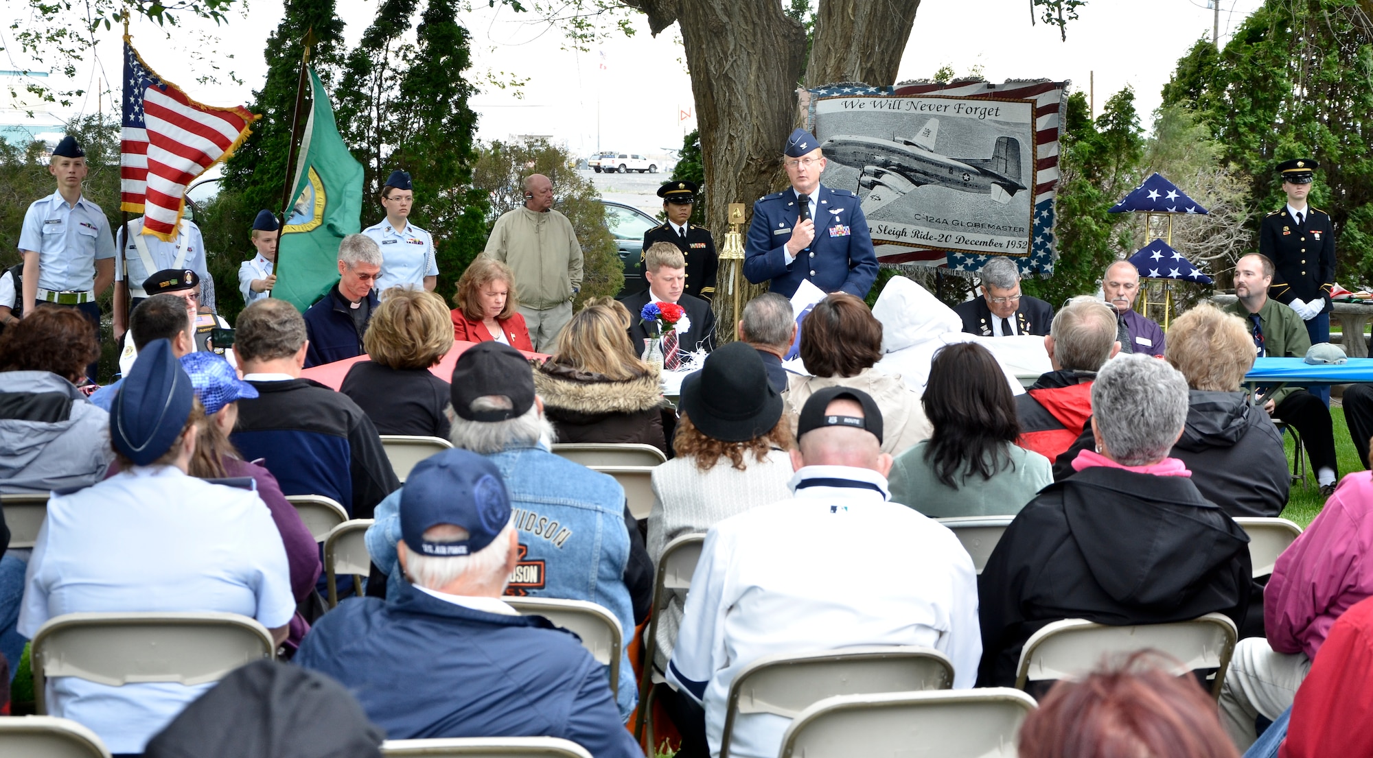 Col. Thomas F. Roshetko, 92nd Medical Group commander, addresses an audience of Korean War veterans, families and friends and community members who honored 87 “Forgotten Heroes” of a tragic 1952 Air Force C-124A Globemaster crash during a memorial dedication ceremony at the Grant County International Airport in Moses Lake, Wash., June 9, 2012. The personnel transport took off Dec. 20, 1952, from what was then Larson Air Force Base as part of a continuation trip from Korea called “Operation Sleighride,” bringing servicemembers home for the holidays. (U.S. Air Force photo by Senior Airman Benjamin Stratton/Released)