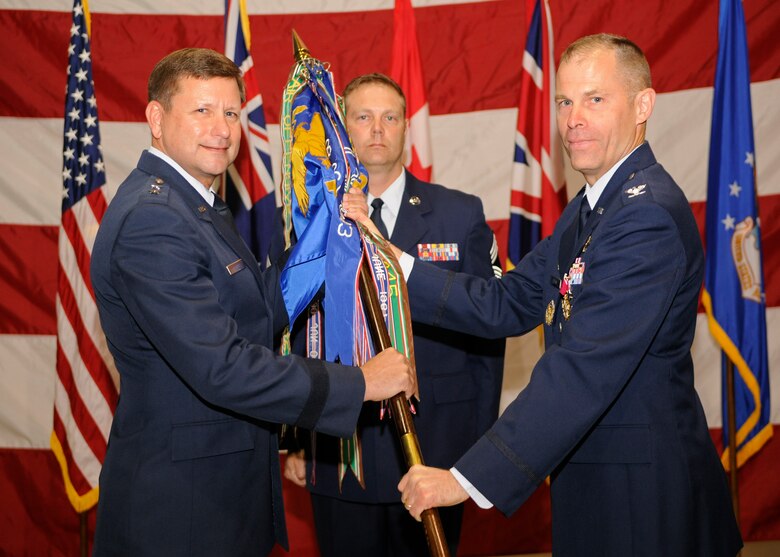 VANDENBERG AIR FORCE BASE, Calif. -- Col. Lutton, 381st Training Group commander, passes the official guidon to Maj Gen. Leonard Patrick, 2nd Air Force commander, during a change of command ceremony here June 13, 2012. Lutton commanded the 381st TRG from July 7, 2010 to June 13, 2012. (U.S. Air Force photo/Michael Peterson)