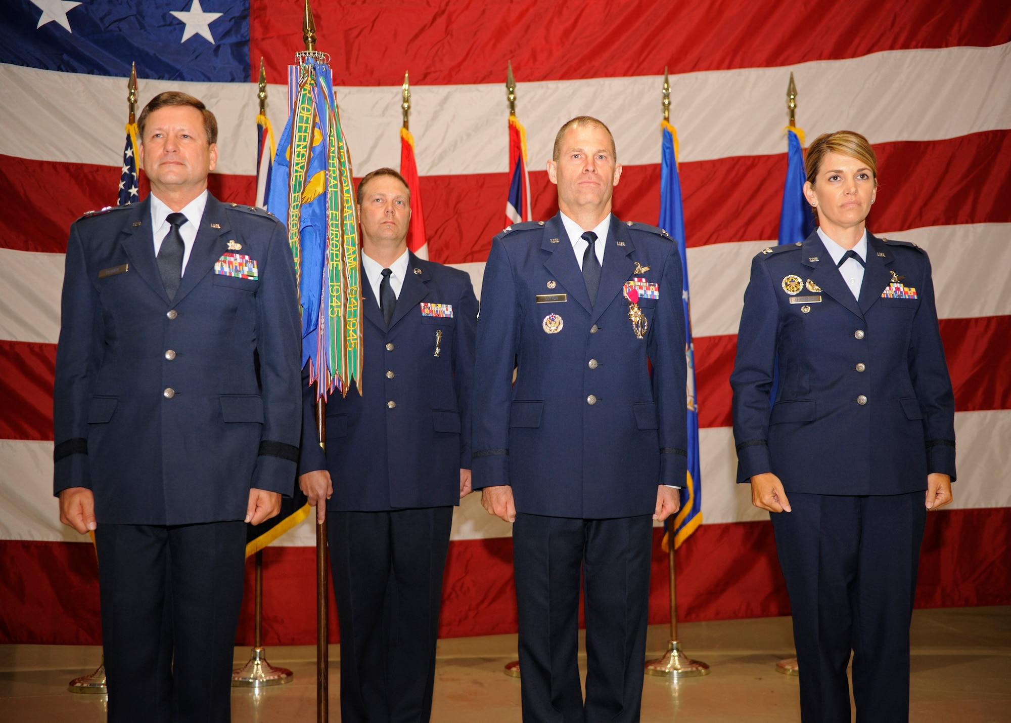 VANDENBERG AIR FORCE BASE, Calif. -- Maj. Gen. Leonard Patrick, 2nd Air Force commander, Chief Master Sgt. Ian Morley, 381st Training Group superintendent, Col. Michael Lutton, 381st Training Group commander, and Col. Michele Edmondson, incoming 381st TRG commander, prepare for exchange of the official guidon during the 381st TRG change of command ceremony here June 13, 2012. (U.S. Air Force photo/Michael Peterson)