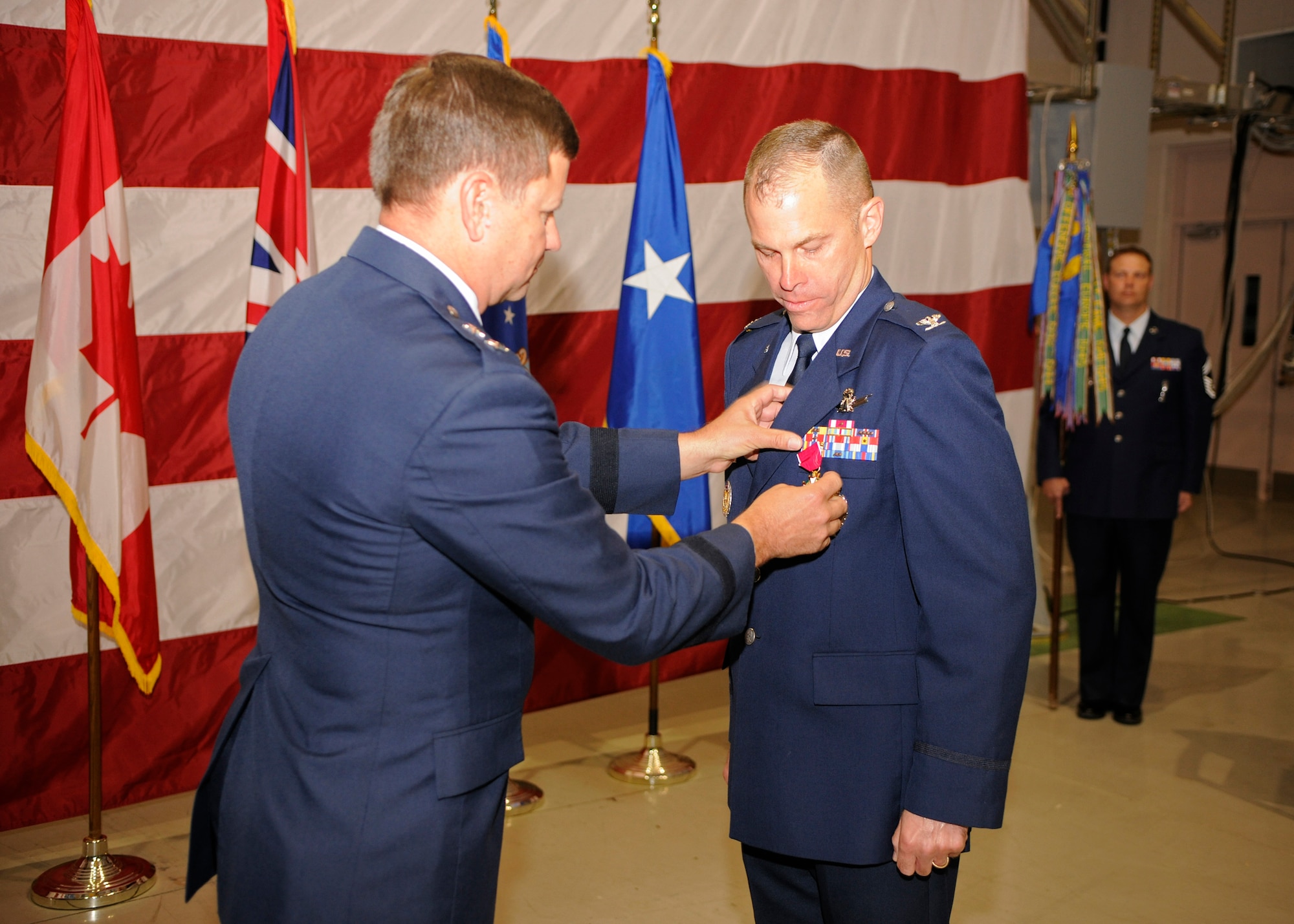 VANDENBERG AIR FORCE BASE, Calif. -- Maj. Gen. Leonard Patrick, 2nd Air Force commander, awards Col. Michael Lutton, 381st Training Group commander, with the Legion of Merit medal before the 381st TRG change of command ceremony here June 13, 2012. Lutton commanded the 381st TRG from July 7, 2010 to June 13, 2012. (U.S. Air Force photo/Michael Peterson)