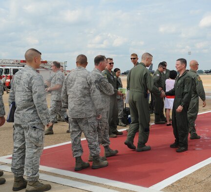 Barksdale Airmen congratulate Col. Thomas Hesterman, 2nd Bomb Wing vice commander, following his 'fini' flight on Barksdale Air Force Base, La., June 13. Hesterman served as the 2 BW vice commander for more than two years and moves on to become the Air Force Global Strike Command Inspector General. Hesterman is a command pilot with more than 4,000 flying hours. (U.S. Air Force photo/Airman 1st Class Benjamin Gonsier)(RELEASED)

