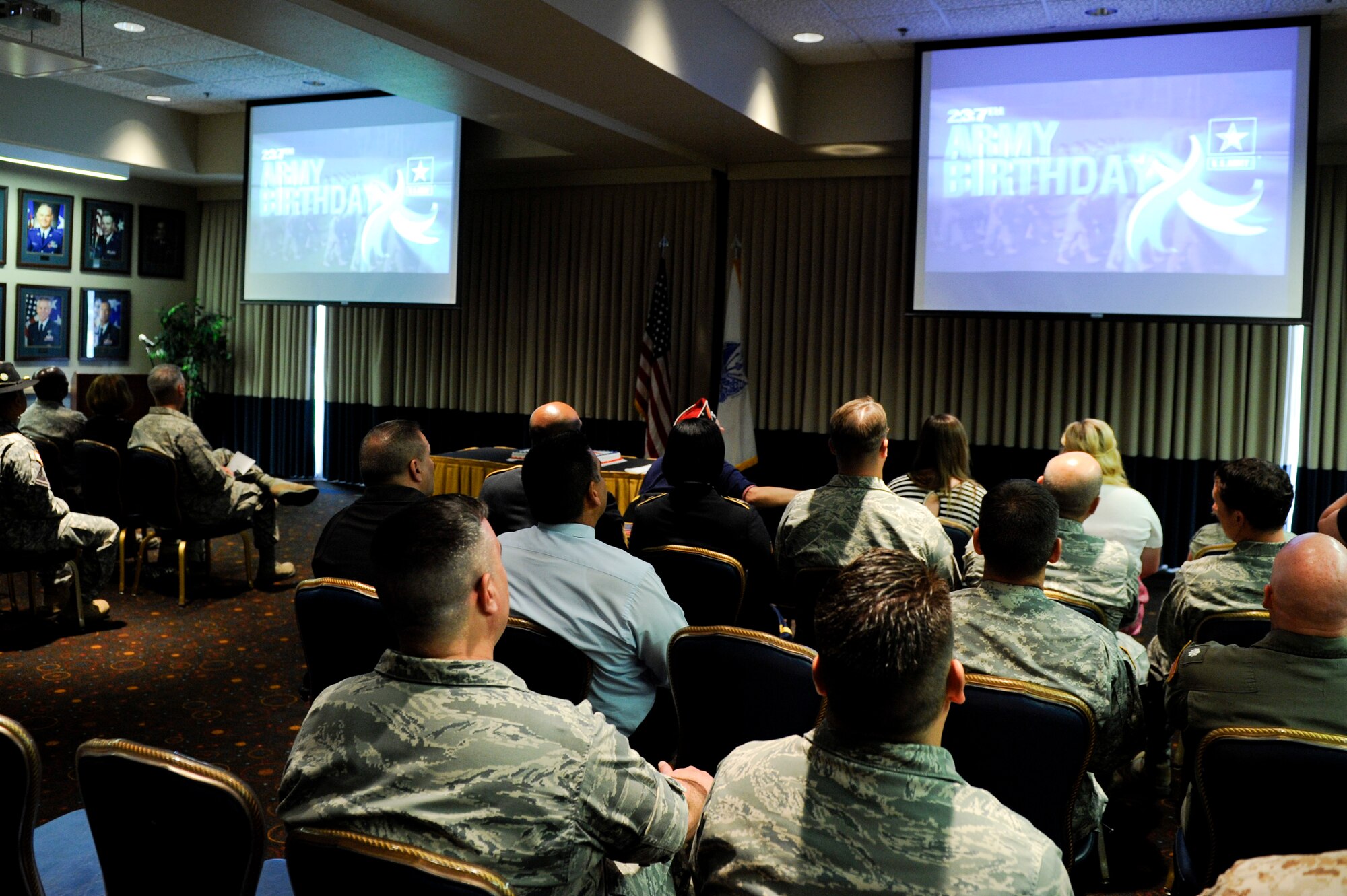 VANDENBERG AIR FORCE BASE, Calif.-- Team V members enjoy a birthday celebration video during the 237th Army Birthday Celebration at the Pacific Coast Club here Thursday, June 14, 2012.Founded in 1775, the U.S. Army has grown from an amateur force of colonial freedom fighters to a professional force of more than one million soldiers fighting terrorism worldwide and providing support for international operations. (U.S. Air Force photo/Staff Sgt. Levi Riendeau)