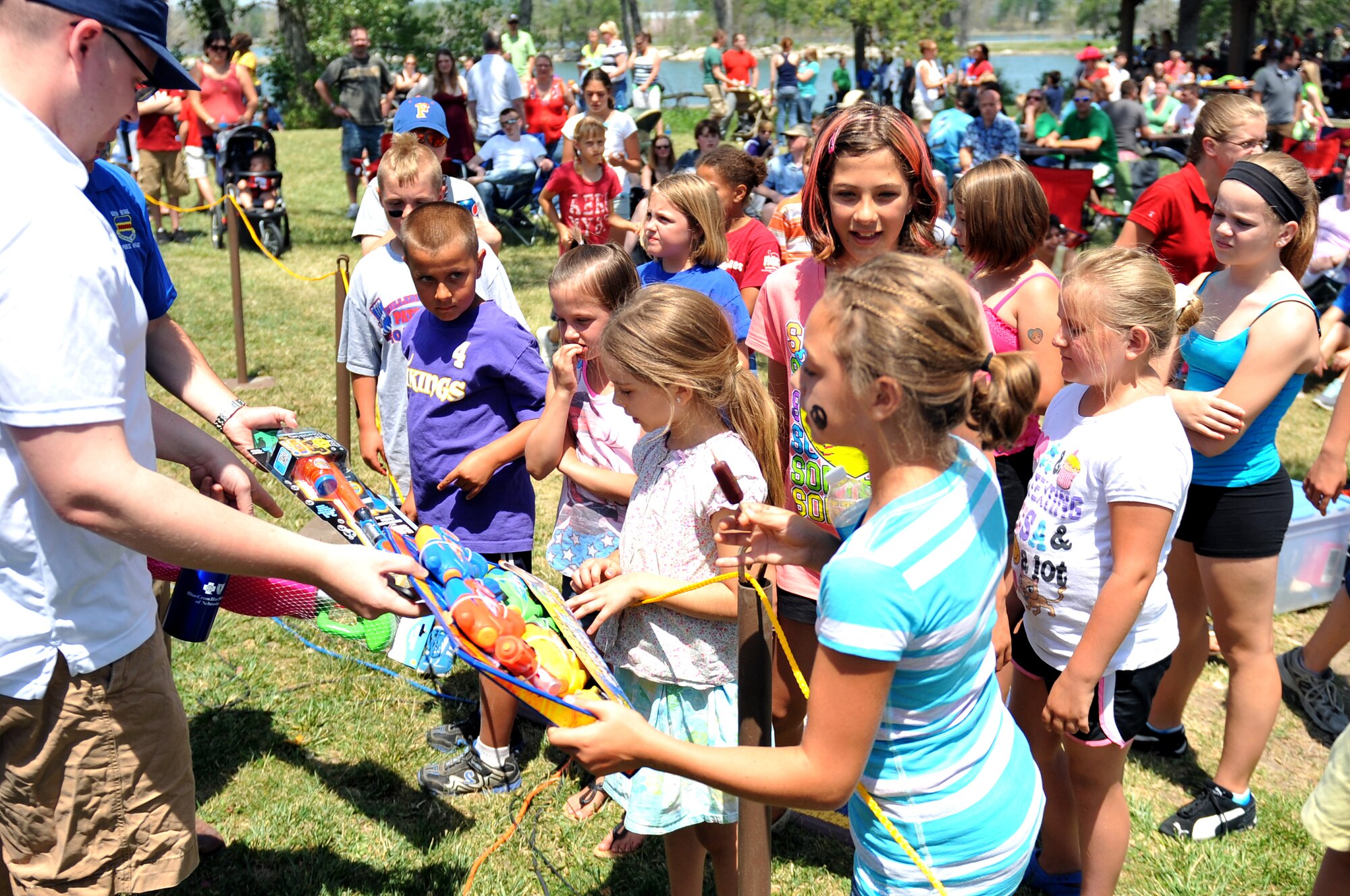 Children gather to look at the prizes that were offered at the Offutt Advisory Council's annual Offutt Appreciation Day Picnic at the Offutt Air Force Base Lake June 8. Team Offutt children also got to enjoy face-painting, bounce-houses, zoo animals and more during this event. (U.S. Air Force photo by Jeff W. Gates/Released)