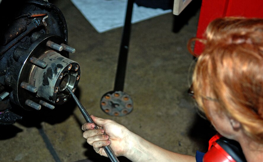 Airman 1st Class Steffany Toler, 2nd Logistics Readiness Squadron Vehicle Maintenance Flight, removes a seal while doing scheduled service to the rear brakes on a vehicle at Barksdale Air Force Base, La., June 12. The VMF maintains and services more than 700 vehicles at this facility. (U.S. Air Force photo/Staff Sgt. Jason McCasland)(RELEASED)