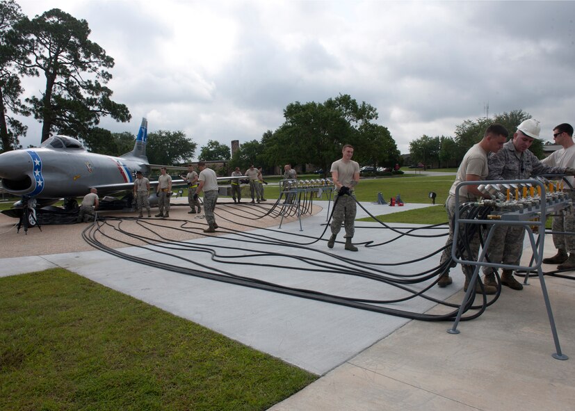 Moody Airmen work together to lift an F-86L Sabre to be mounted to the ground with rubber inflation mattresses at the President George W. Bush Air Park at Moody Field June 12, 2012, at Moody Air Force Base, Ga. The historic aircraft was brought to the base April 25 by several community and base agencies that helped make the relocation a success. The F-86 has undergone extensive restoration and now resides at the air park. (U.S. Air Force photo by Senior Airman Eileen Meier/Released)