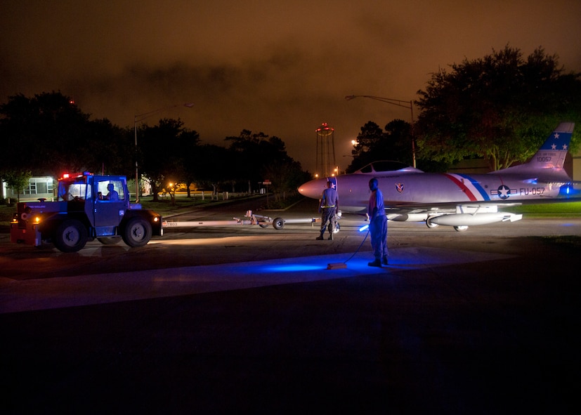 A newly refurbished F-86L Sabre is towed to its final destination at the President George W. Bush Air Park at Moody Field in the early morning of June 12, 2012, at Moody Air Force Base, Ga. The historic aircraft originally sat in downtown Valdosta but is now back in the hands of the U.S. Air Force to be displayed with other aircraft that have flown at Moody. (U.S. Air Force photo by Senior Airman Eileen Meier/Released)