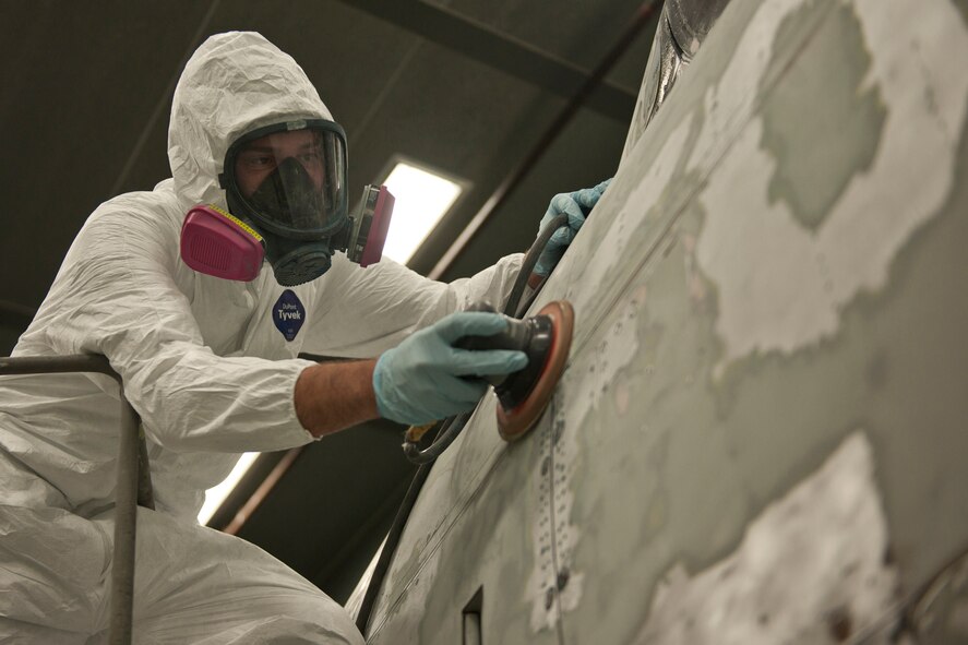 U.S. Air Force Staff Sgt. Jordan Keller, 23d Equipment Maintenance Squadron, uses a sander to remove paint from an F-86L Sabre being restored and displayed at the President George W. Bush Air Park at Moody Field at the fabrication flight hangar at Moody Air Force Base, Ga. June 6, 2012. The historic aircraft was relocated from downtown Valdosta April 25 and has taken 550 man hours and $6,000 in material costs to refurbish. (U.S. Air Force photo by Senior Airman Eileen Meier/Released)