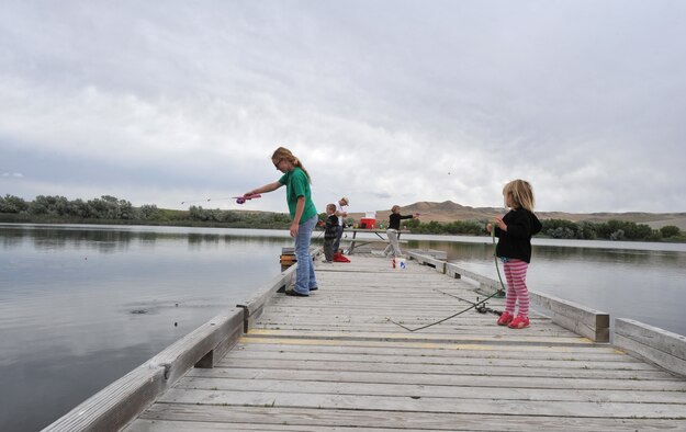 The Lowe family fishes off a dock at Bruneau Dunes State Park, Idaho, June 7, 2012. The family, from Kuna, Idaho, went to the park for a family fun day, starting with climbing the dunes followed by fishing and a picnic. (U.S. Air Force photo/Airman 1st Class Heather Hayward)