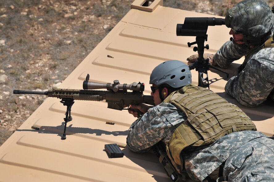 U.S. Army soldiers survey the terrain during training at Melrose Air Force Range, N.M., June 11, 2012. Teams spent the day at the range practicing tactics and perfecting skills. (U.S. Air Force photo by Airman 1st Class Xavier Lockley)