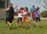 KIRTLAND AFB, N.M. -- Children play “Capture the Flag” June 4 during the Kirtland Air Force Base Chapel’s weeklong summer camp — Son Surf Beach Bash Vacation Bible School. Throughout the week, children participated in games, created crafts, sang songs and received religious training. (Photo by Todd Berenger)