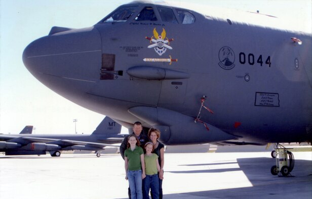 Colonel Bobby Bender poses in front of a B-52H at Minot Air Force Base, N.D., with his wife Angela and their daughters, Madeline and Victoria in 2003. (Photo provided)