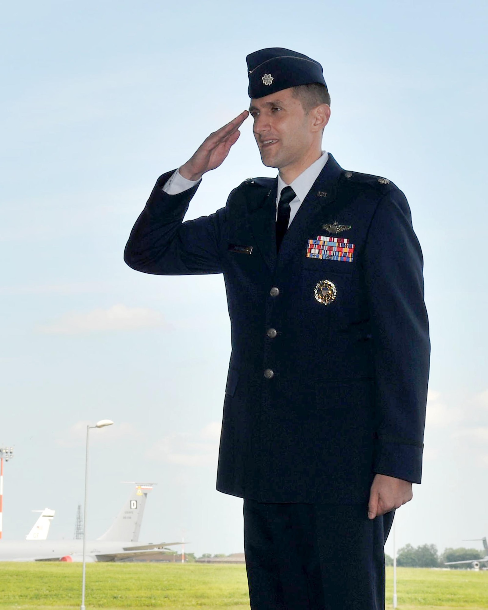 RAF MILDENHALL, England – Lt. Col. Timothy Kuehne renders his first salute as the 351st Air Refueling Squadron commander during a change-of-command ceremony here June 14, 2012. Before taking command of the squadron, Kuehne served as 100th Air Refueling Wing Safety chief. (U.S. Air Force photo/Senior Airman Jerilyn Quintanilla) 