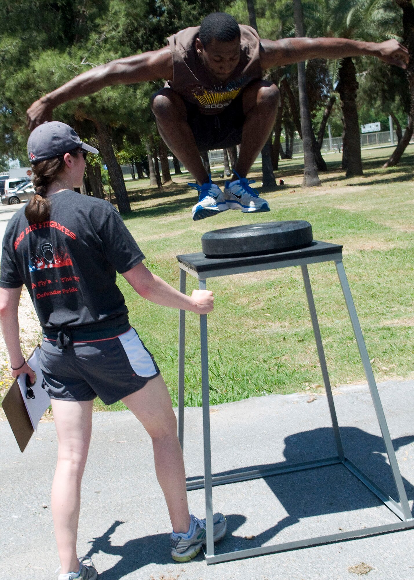 Tereaud Morris, 39th Communications Squadron, completes a three-foot jump on to a stand during the 'Lik Fit Games June 8, 2012, at Incirlik Air Base, Turkey. The obstacle, called High Fly'n, was one of three included in the event, and was designed to test participant's physical and mental strength. (U.S. Air Force photo by Senior Airman Marissa Tucker/Released) 