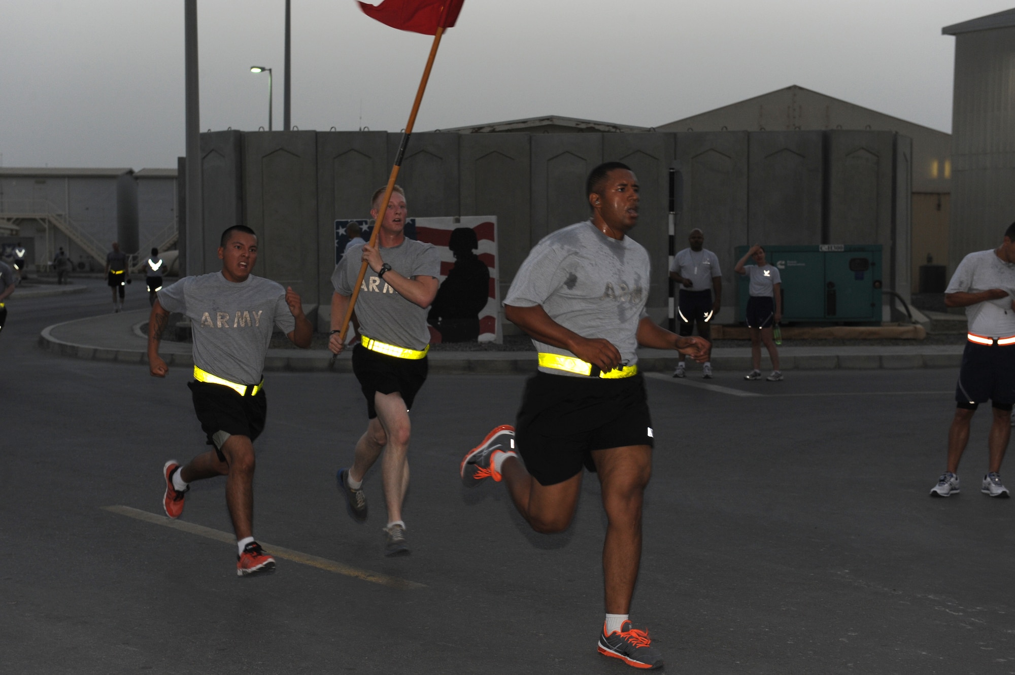 SOUTHWEST ASIA - Soldiers from the 1st Battalion, 7th Air Defense Artillery  Regiment race to the finish of a 5K run/ruck march at the 380th Air Expeditionary Wing June 14, 2012. The event was held to celebrate the U.S. Army's 237th birthday. The Soldiers are deployed from Fort Bragg, N.C. (U.S. Air Force photo/Master Sgt. Scott MacKay)
