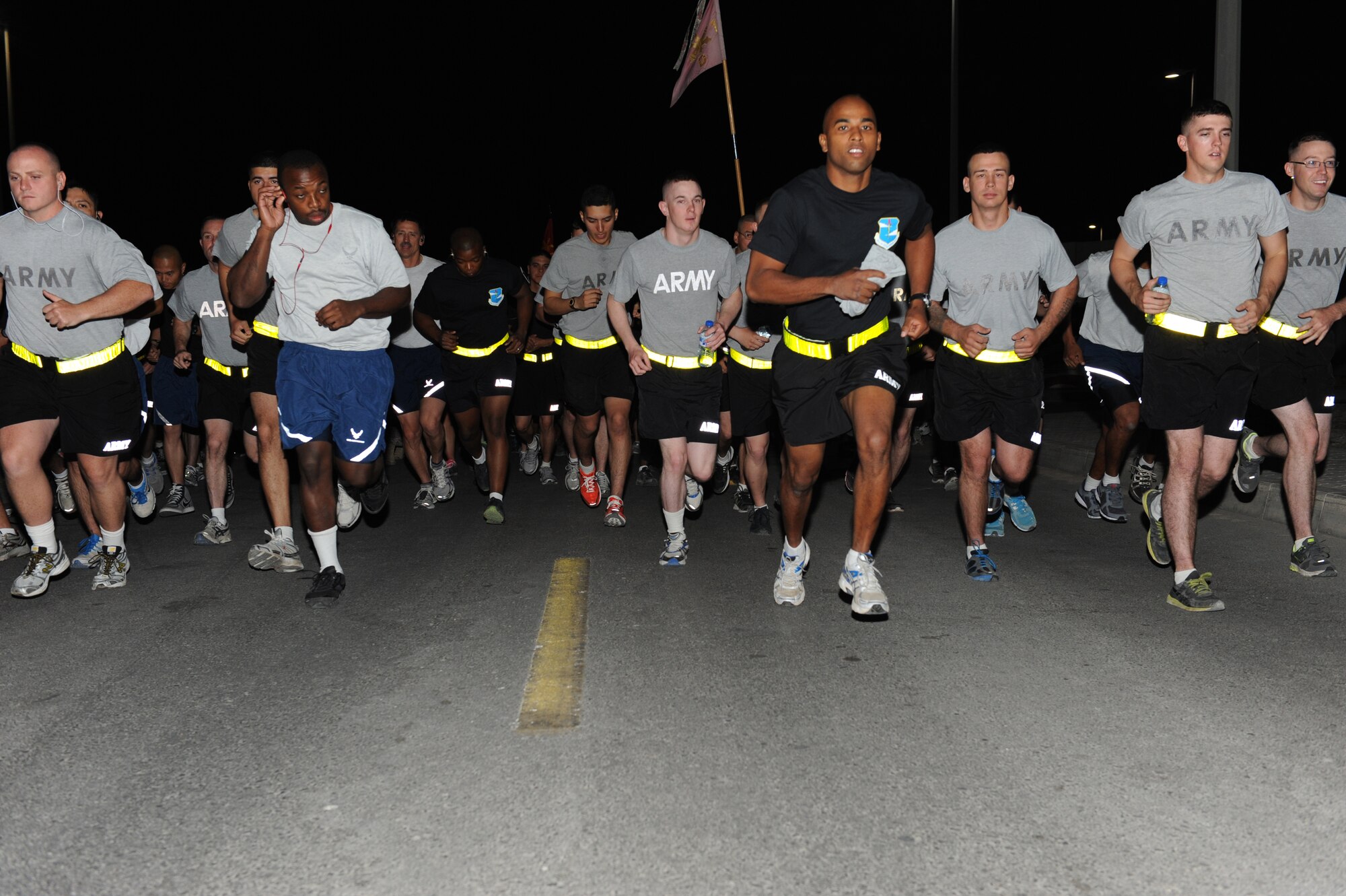 SOUTHWEST ASIA - Airmen and Soldiers start a 5K run/ruck march at the 380th Air Expeditionary Wing June 14, 2012. The event was held to celebrate the U.S. Army's 237th birthday. The Soldiers are deployed from Fort Bragg, N.C.(U.S. Air Force photo/Master Sgt. Scott MacKay)