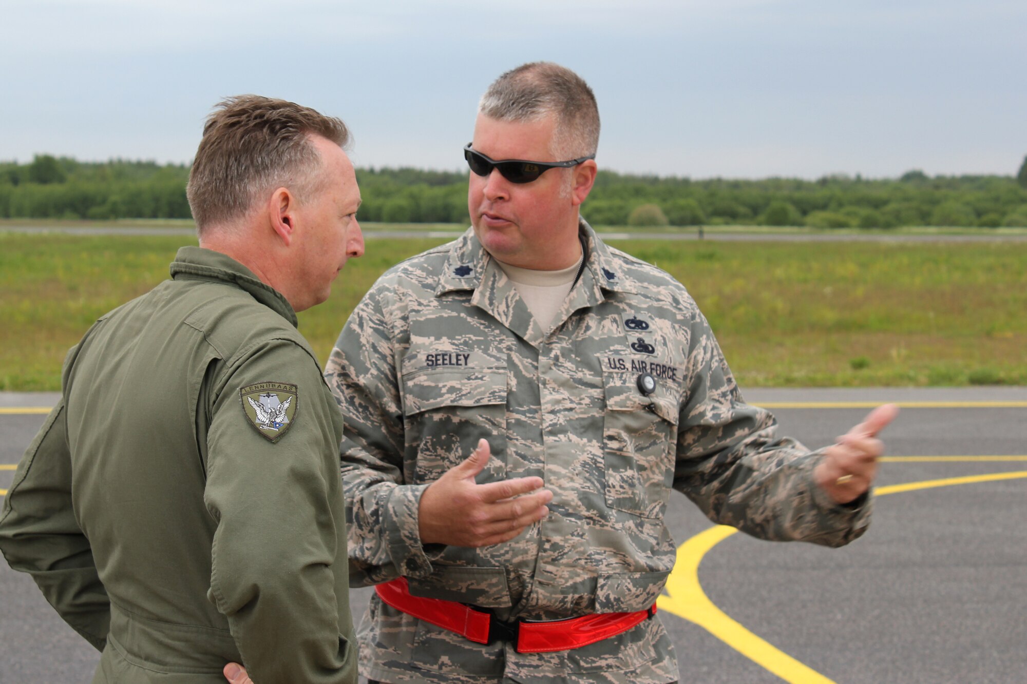 Estonian Lt. Col. Roman Timofejev talks with U.S. Lt. Col. Robert Seeley on the flight line at the Amari Air Base in Estonia, June 10, 2012. Michigan Air National Guard Airmen deployed to Estonia in mid June 2012 in support of Saber Strike 2012, a multinational exercise based in Latvia and Estonia. (Air National Guard photo by TSgt. Dan Heaton)
