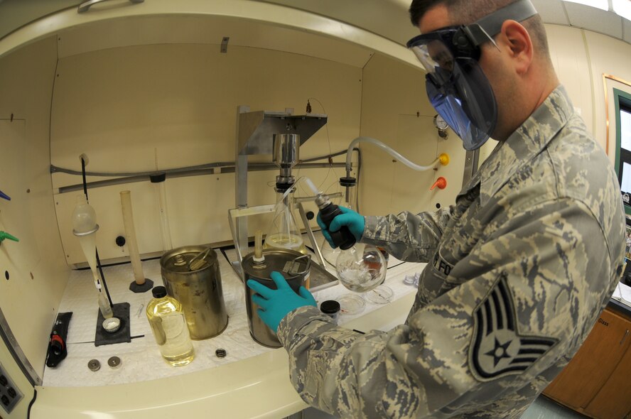 Staff Sergeant Andrew McKeown, 914th Airlift Wing fuels specialist, performs tests on a fuel sample in the lab. The filter is weighed before and after a fuel sample is filtered to get a precise reading of any sediment or water that may be in the fuel. (U.S. Air Force photo by Senior Airman Jessica Mae Snow)