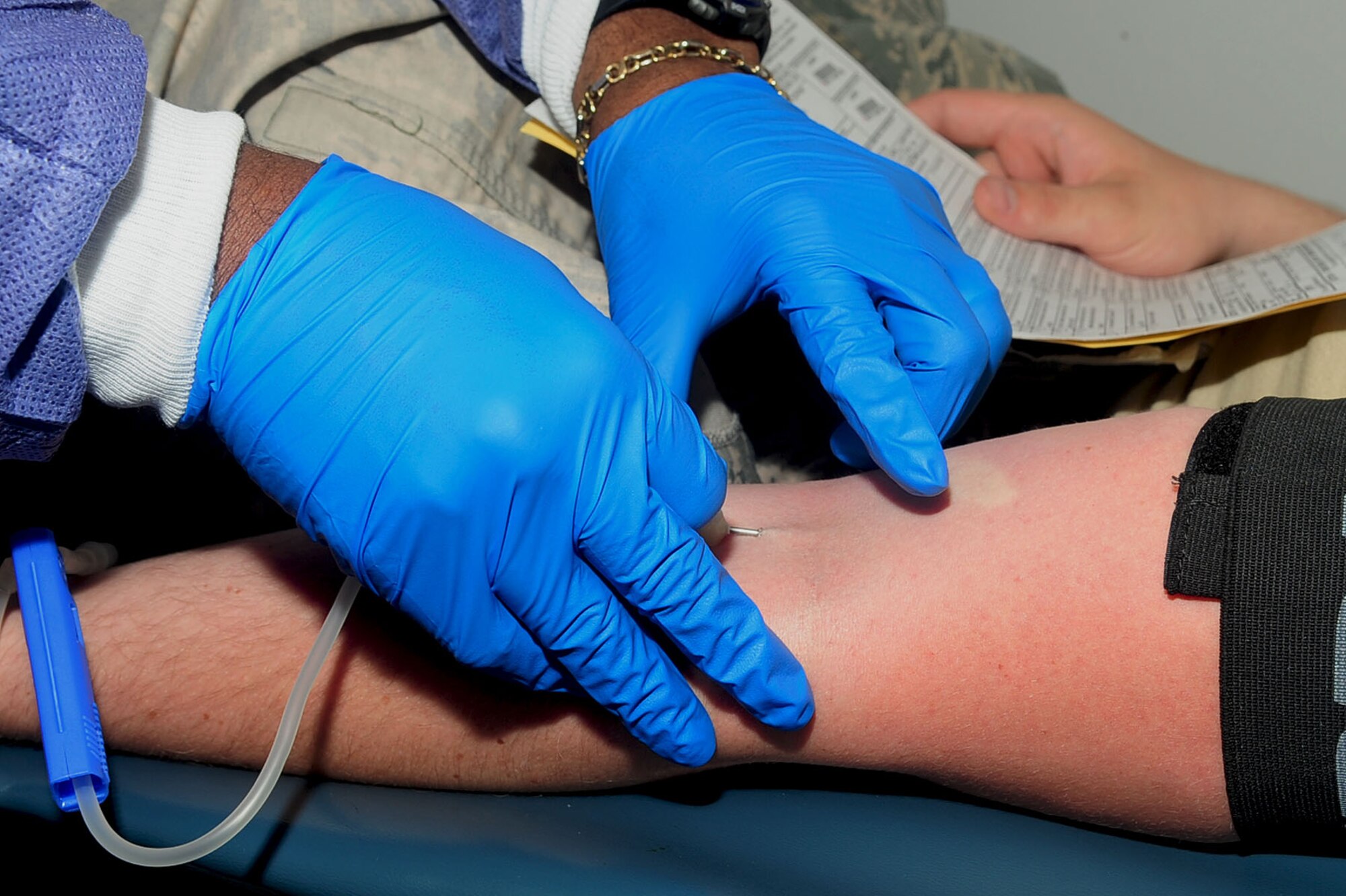 A U.S. Air Force Airman prepares to give blood during a blood drive at Langley Air Force Base, Va., June 12, 2012. The Armed forces blood program is the only Department of Defense blood-donor program available to active-duty personnel. (U.S. Air Force photo by Staff Sgt. Ashley Hawkins/Released)
