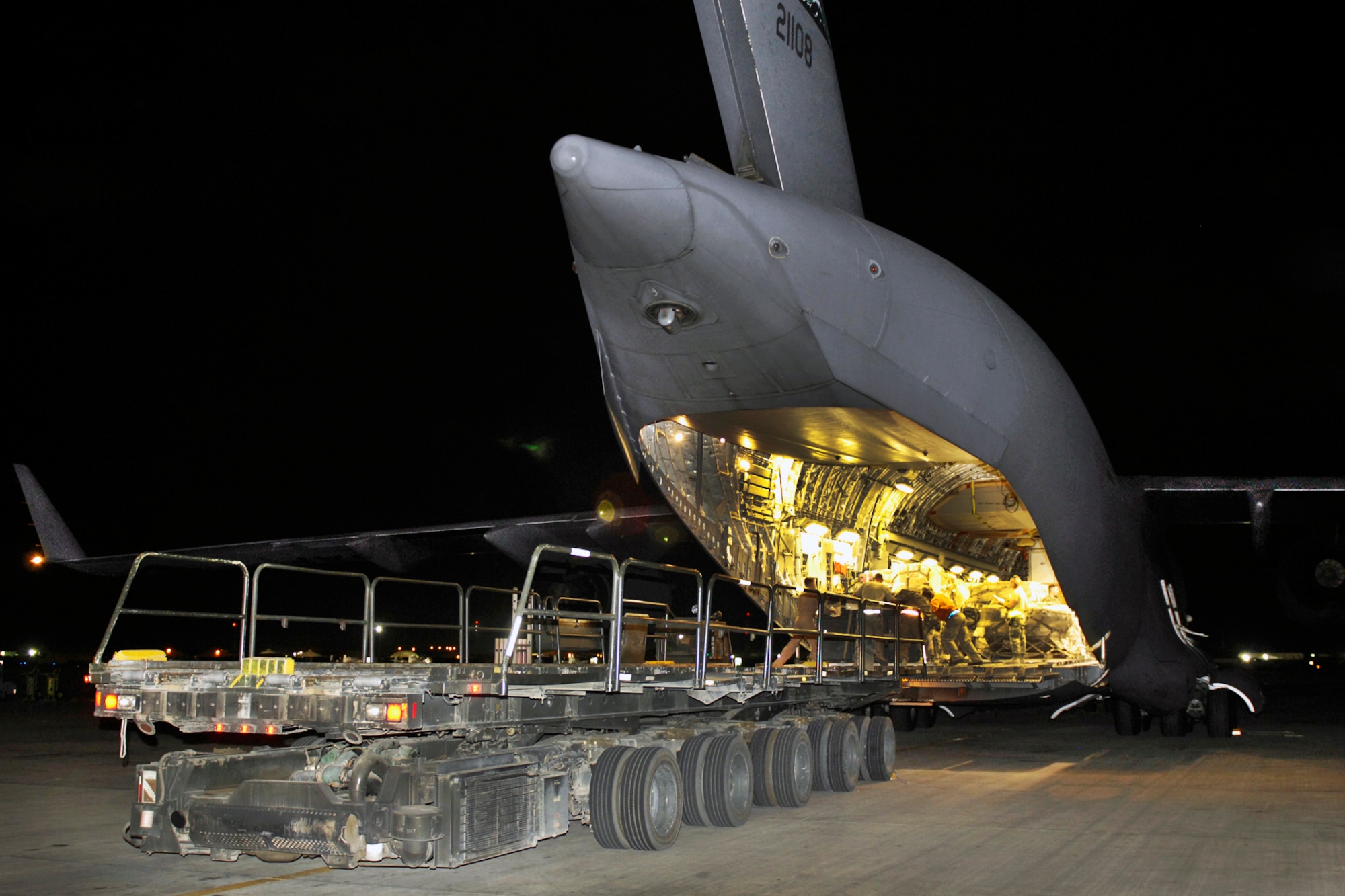 Airmen unload cargo from a U.S. Air Force C-17 Globemaster III at Bagram 
Airfield, Afghanistan, June 6, 2012. Hundreds of passengers and more than one million pounds of cargo process through Bagram daily in support of U.S. and Coalition Forces in Afghanistan. (U.S. Air Force photo/Staff Sgt. Jeff Nevison)