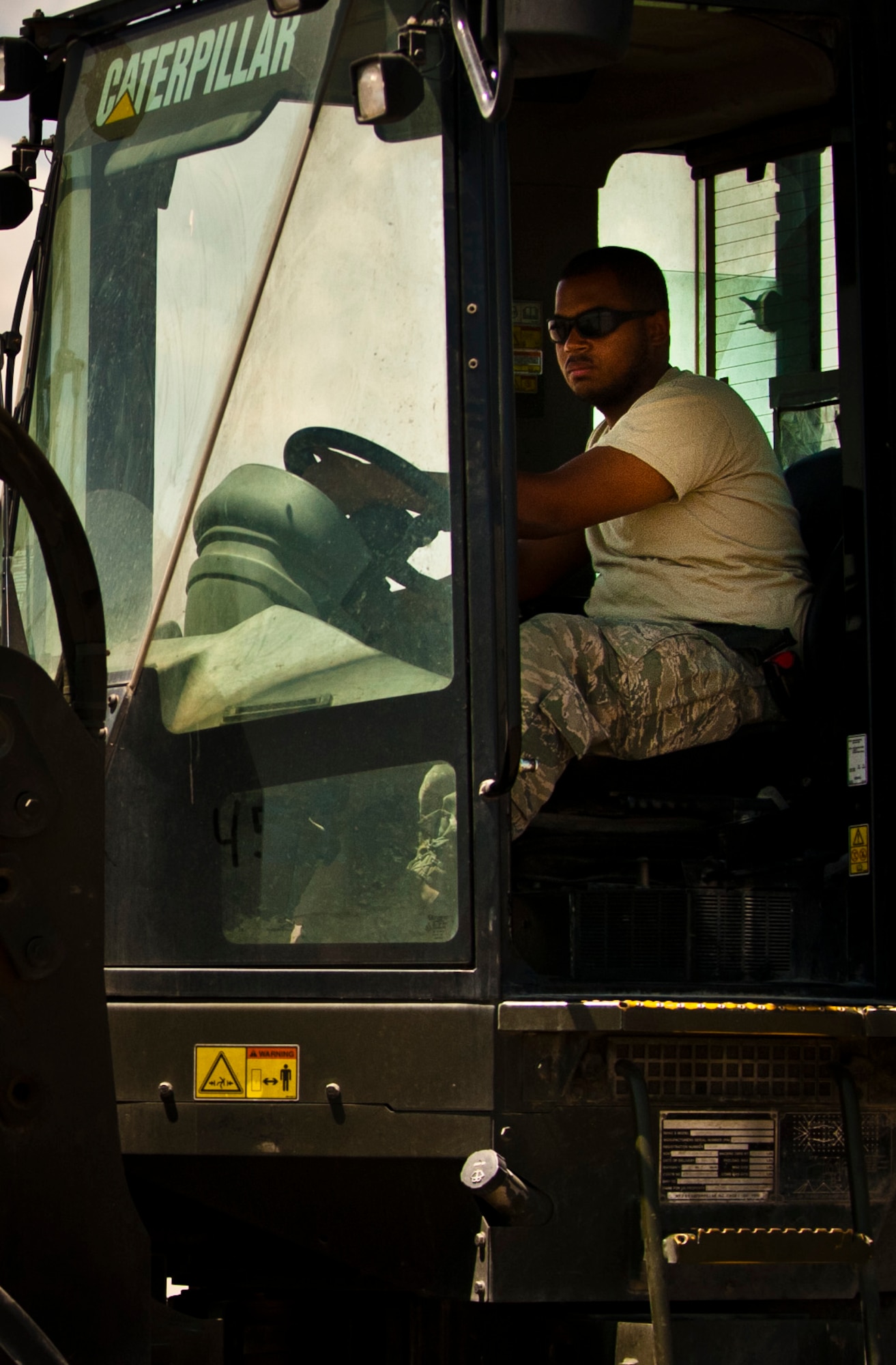 Senior Airman Yael Perez, 455th Expeditionary Aerial Port Squadron, Passenger Service agent, loads cargo with a 10K all-terrain forklift at Bagram Airfield, Afghanistan, June 8, 2012. Personnel from 455 EAPS process more than 100 missions daily. (U.S. Air Force photo/Capt. Raymond Geoffroy)