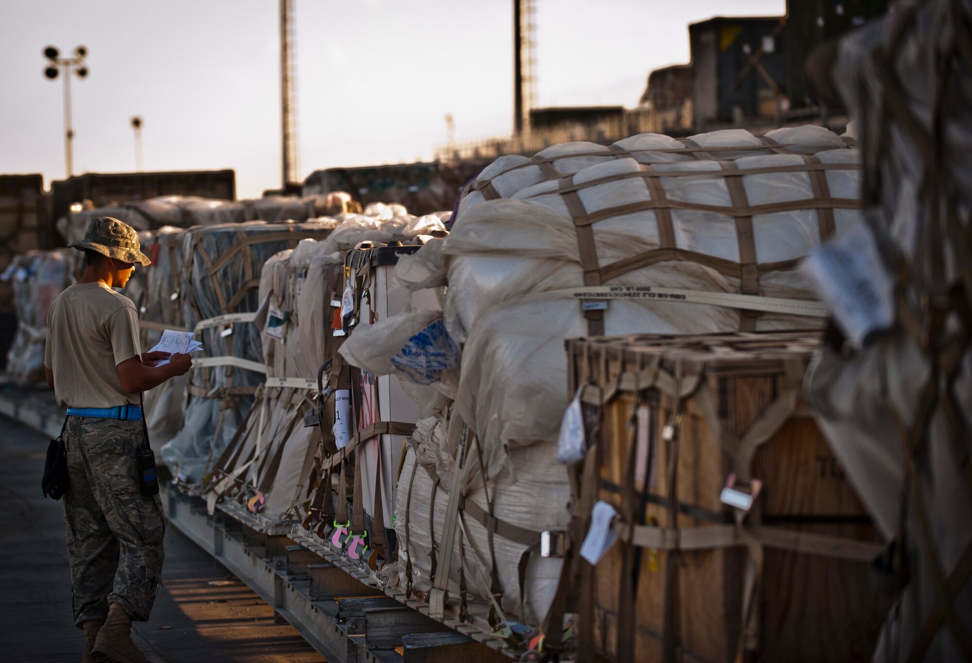 An Airman assigned to the 455th Expeditionary Aerial Port Squadron inspects pallets of equipment and supplies in the cargo yard at Bagram Airfield, Afghanistan, June 8, 2012. Personnel with 455 EAPS process more than 1 million lbs of cargo every day in support of U.S. and Coalition forces operating in Afghanistan. (U.S. Air Force photo/ Capt. Raymond Geoffroy)