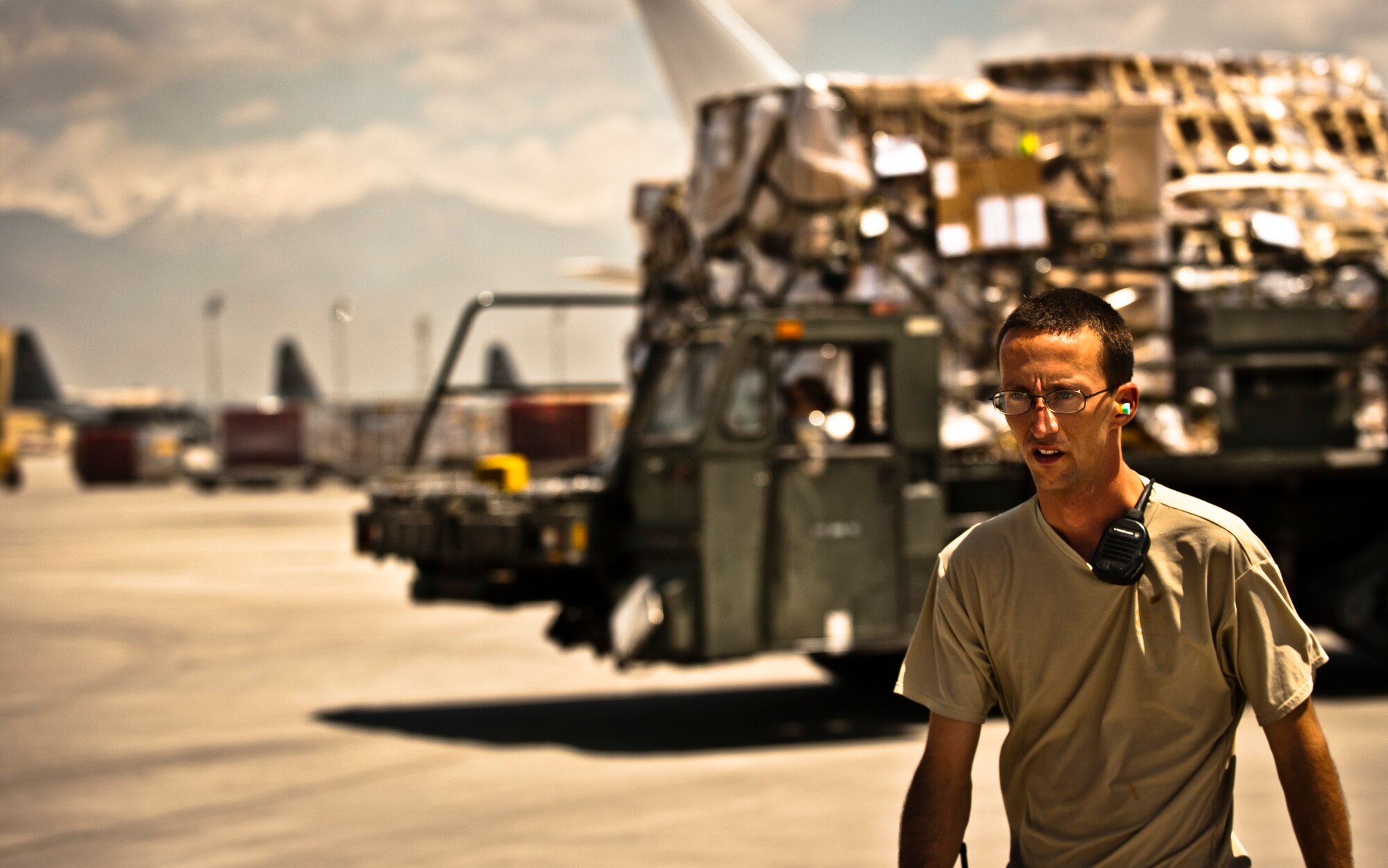 Tech. Sgt. Randy Owens, Ramp Services Load Team chief, coordinates a cargo off-load at Bagram Airfield, Afghanistan, June 8, 2012. Personnel with 455 EAPS process more than one million pounds of cargo every day in support of U.S. and Coalition forces operating in Afghanistan. (U.S. Air Force photo/Capt. Raymond Geoffroy) 