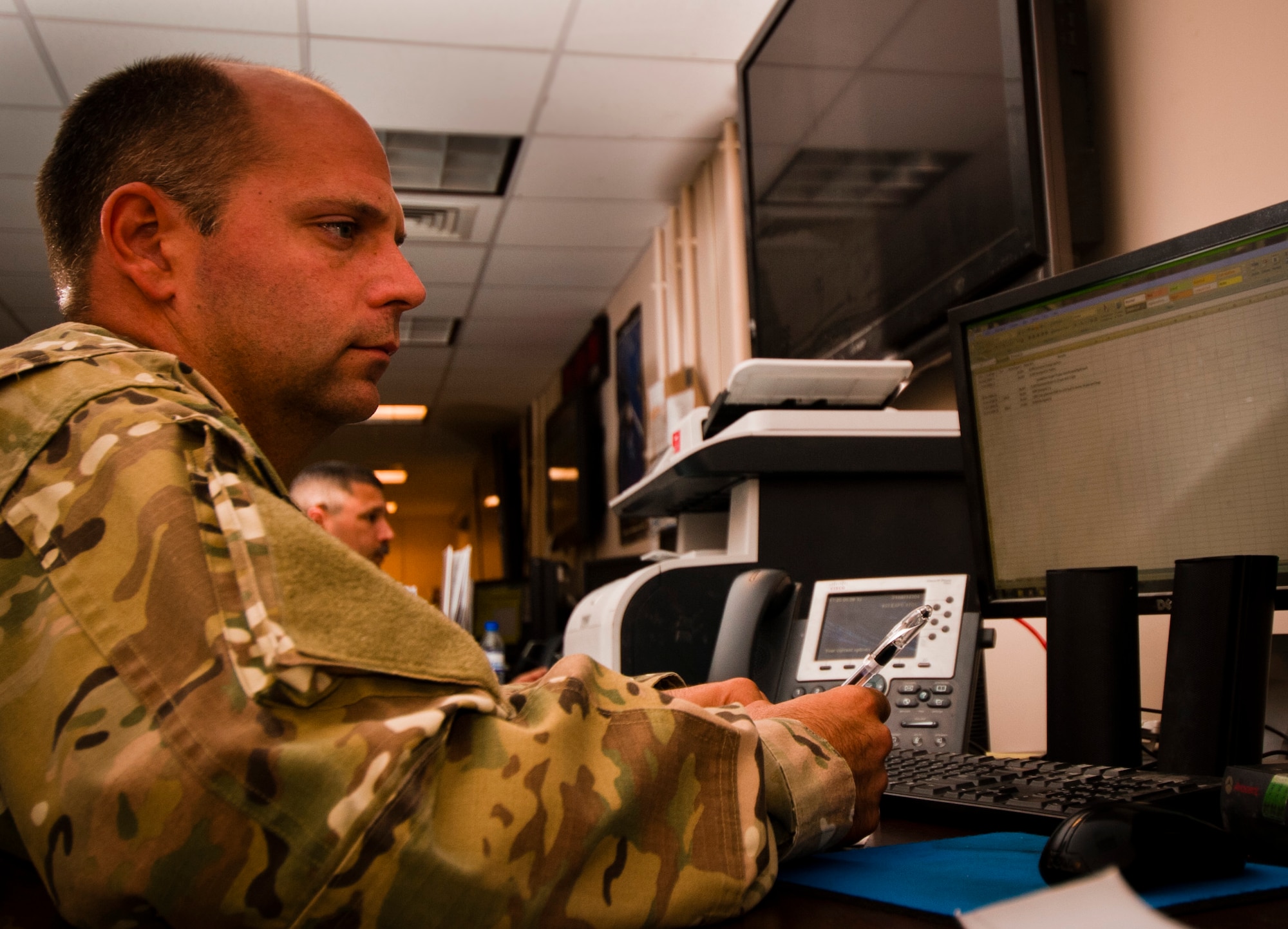 Senior Master Sgt. Richard Bloxham, 455th Expeditionary Aerial Port Squadron Air Terminal Operations Center superintendent, reviews load plans at Bagram Airfield, Afghanistan, June 8, 2012. Personnel from 455 EAPS process more than 100 missions daily. (U.S. Air Force photo/Capt. Raymond Geoffroy)