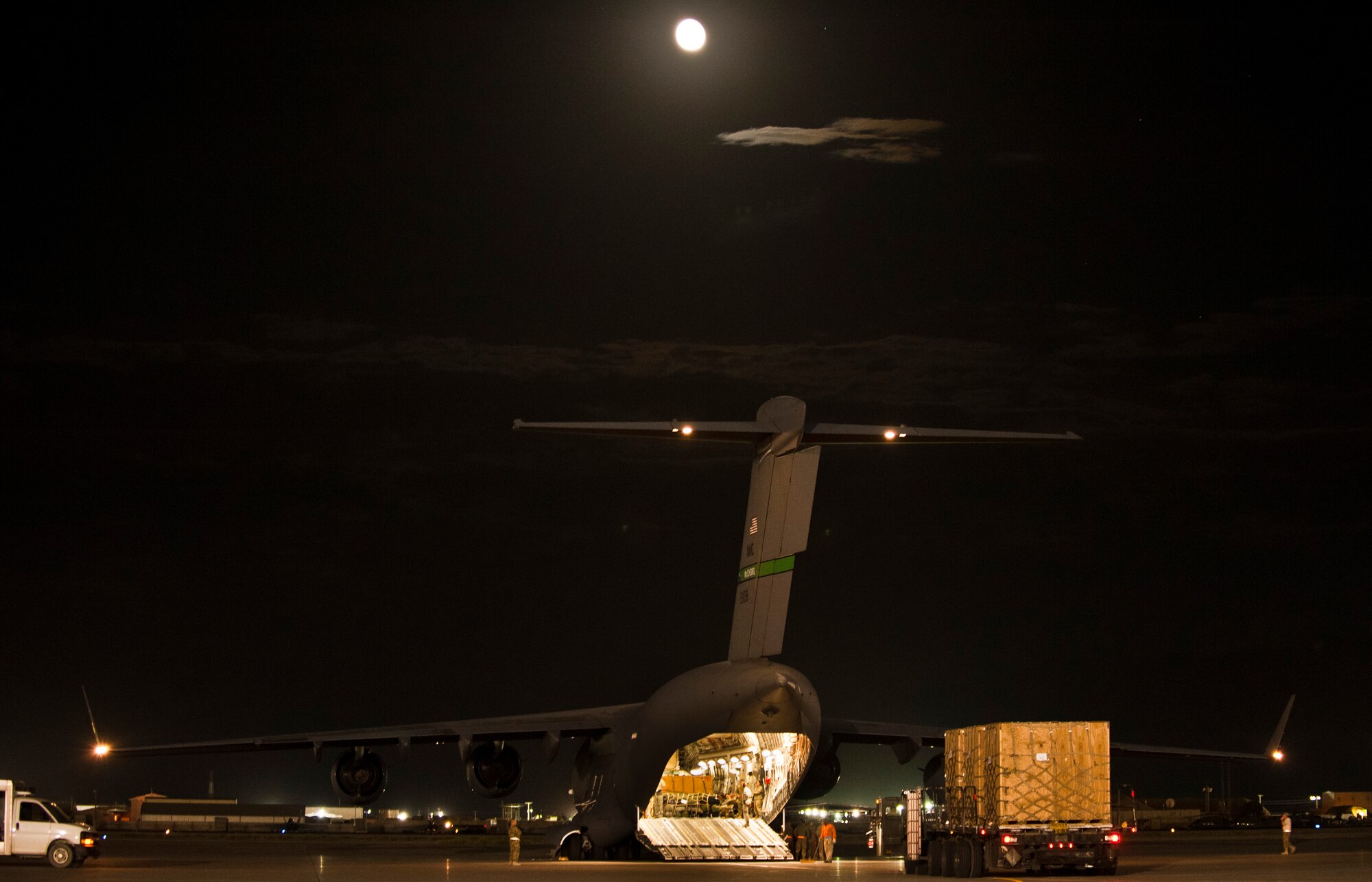 Airmen with the 455th Expeditionary Aerial Port Squadron unload cargo from a U.S. Air Force C-17 Globemaster III at Bagram Airfield, Afghanistan, June 7, 2012. Airmen at Bagram process and move more than 1 million pounds of cargo every day. (U.S. Air Force photo/Capt. Raymond Geoffroy)