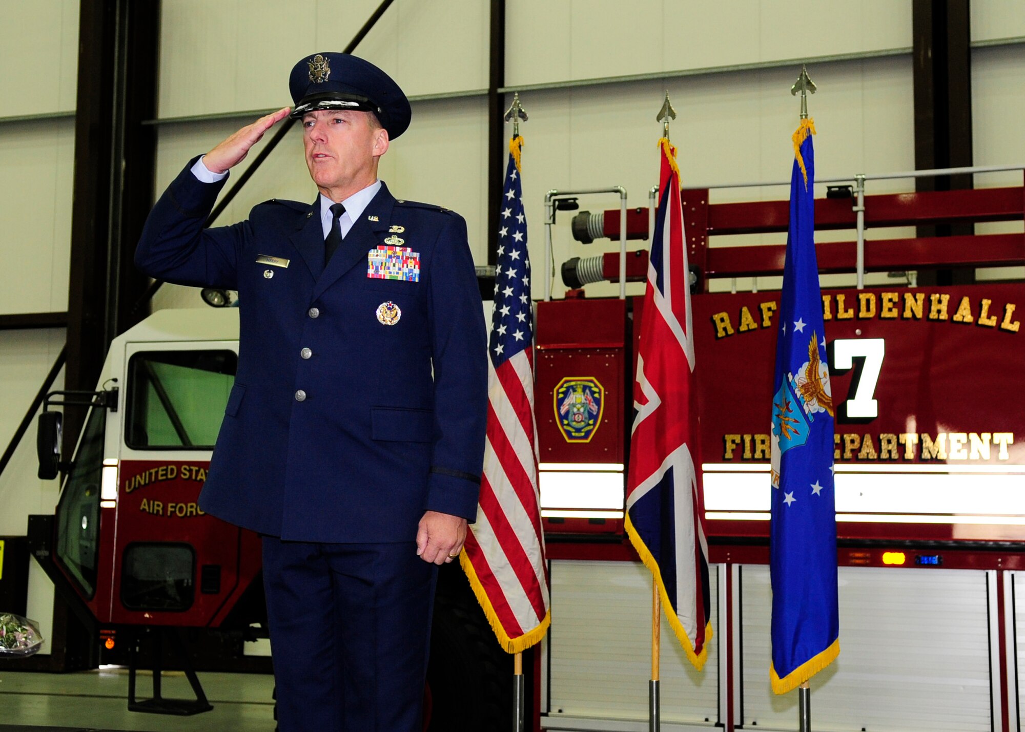 RAF MILDENHALL, England – Col. Daniel Merry, 100th Mission Support Group commander, salutes the Airmen from his group for the first time as their new commander during the 100th MSG change of command here June 13, 2012. Prior to Merry joining Team Mildenhall, he was the Deputy Director, Plans and Integration, Headquarters Air Force, A1, Pentagon. (U.S. Air Force photo/Senior Airman Ethan Morgan)
