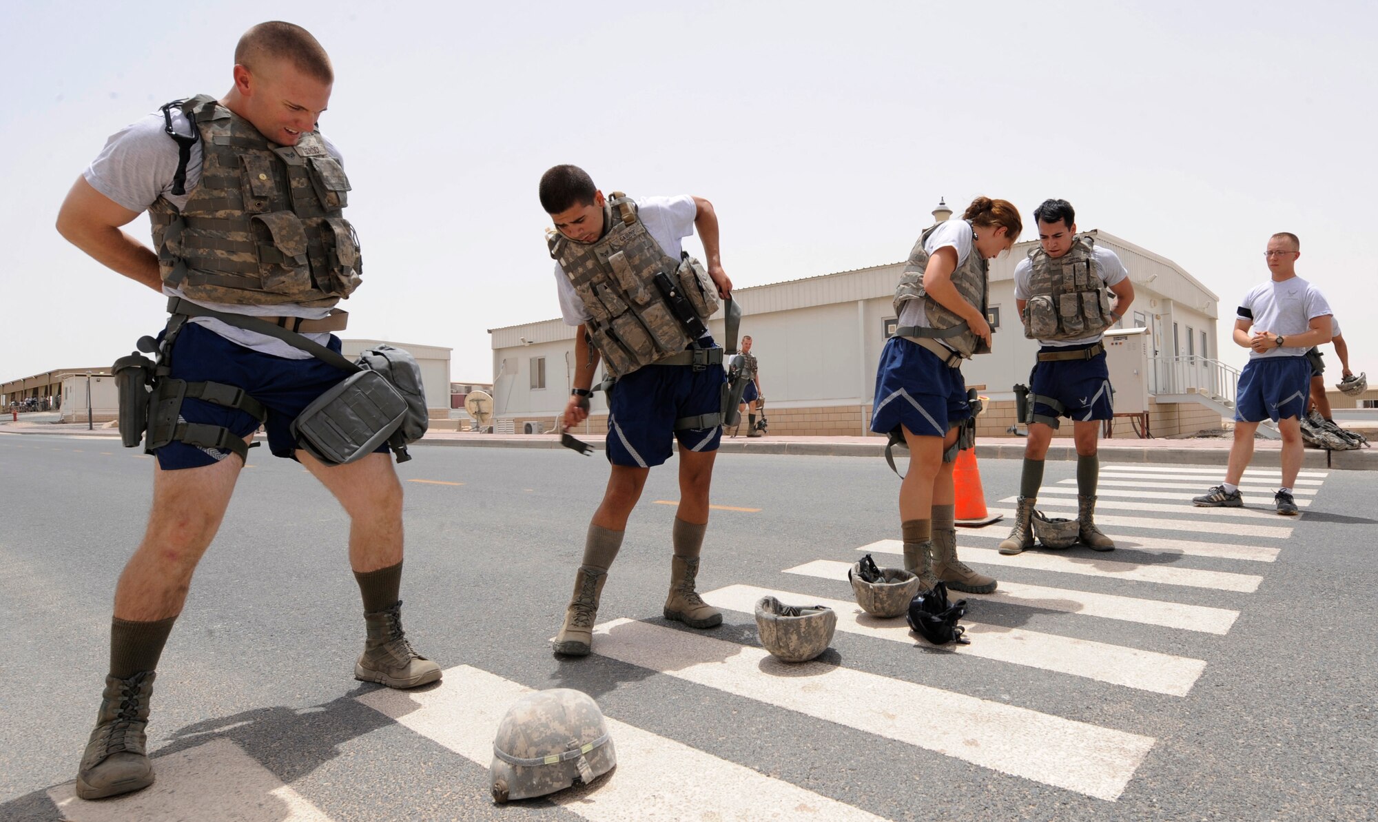 SOUTHWEST ASIA – Members of the 387th Expeditionary Security Forces Squadron race to get geared up during the first Defender Challenge here June 9, 2012.This event is to test response time on donning the uniform up to MOPP 4 minus the Joint Service Lightweight Integrated Suit Technology chemical suit. (U.S. Air Force photo/Staff Sgt. Alexandra M. Boutte) 