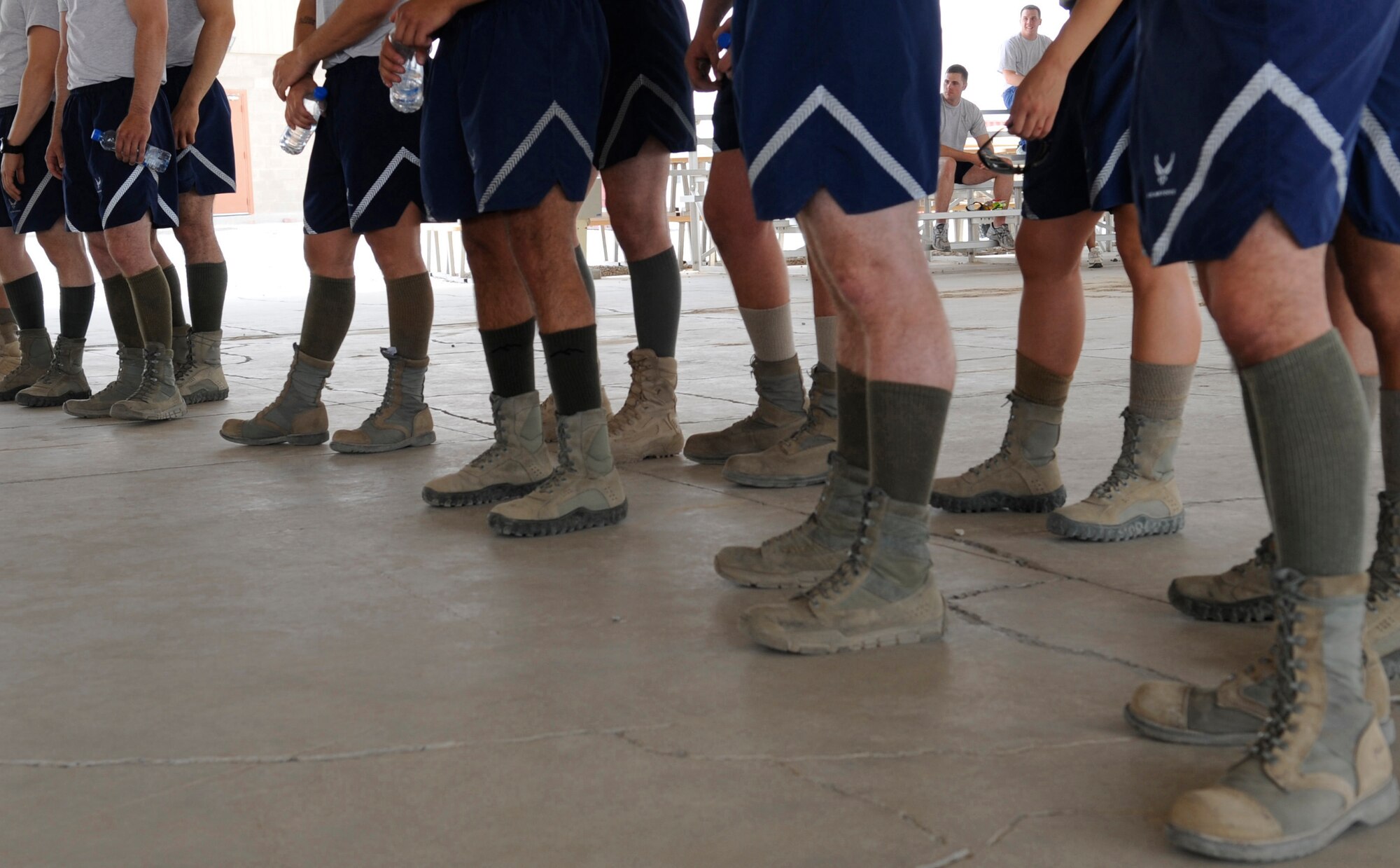 SOUTHWEST ASIA – Members of the 386th and 387th Expeditionary Security Forces Squadrons participate in the first Defender Challenge here June 9, 2012. Seven four-person teams performed five tasks consisting of four-person buddy push-ups, mental and physical challenge, weapon assembly, down driver/gunner and gear relay. The 386th ESFS took home the trophy. (U.S. Air Force photo/Staff Sgt. Alexandra M. Boutte)