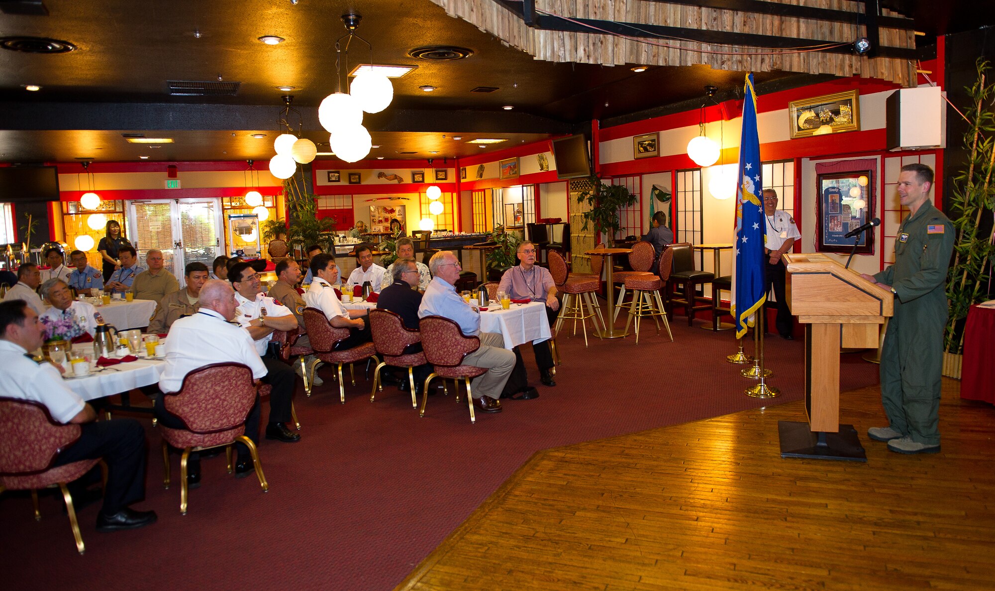 YOKOTA AIR BASE, Japan -- Col. Charles Brown, 374th Airlift Wing vice commander, addresses Japanese firefighters from eight military installations throughout Japan during the closing of the 27th annual U.S. Forces, Japan, Senior Fire Officers' Workshop on June 14, 2012, Yokota Air Base, Japan. Over a span of five days, the firefighters shared training techniques, stories and methods of improvement. (U.S. Air Force photo by Staff Sgt. Chad C. Strohmeyer)