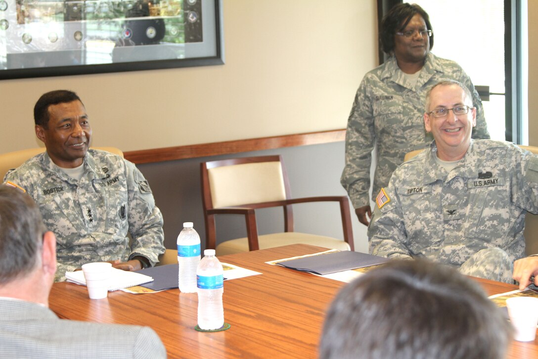 U.S. Army Corps of Engineers Commanding General Thomas P. Bostick and Northwestern Division Deputy Commander Col. Robert A. Tipton shares a laugh with teammates from the Kansas City District and stakeholders on May 25, 2012. Bostick was briefed on the Missouri River Levee System 471-460. U.S. Army Corps of Engineers photo by David S. Kolarik. 