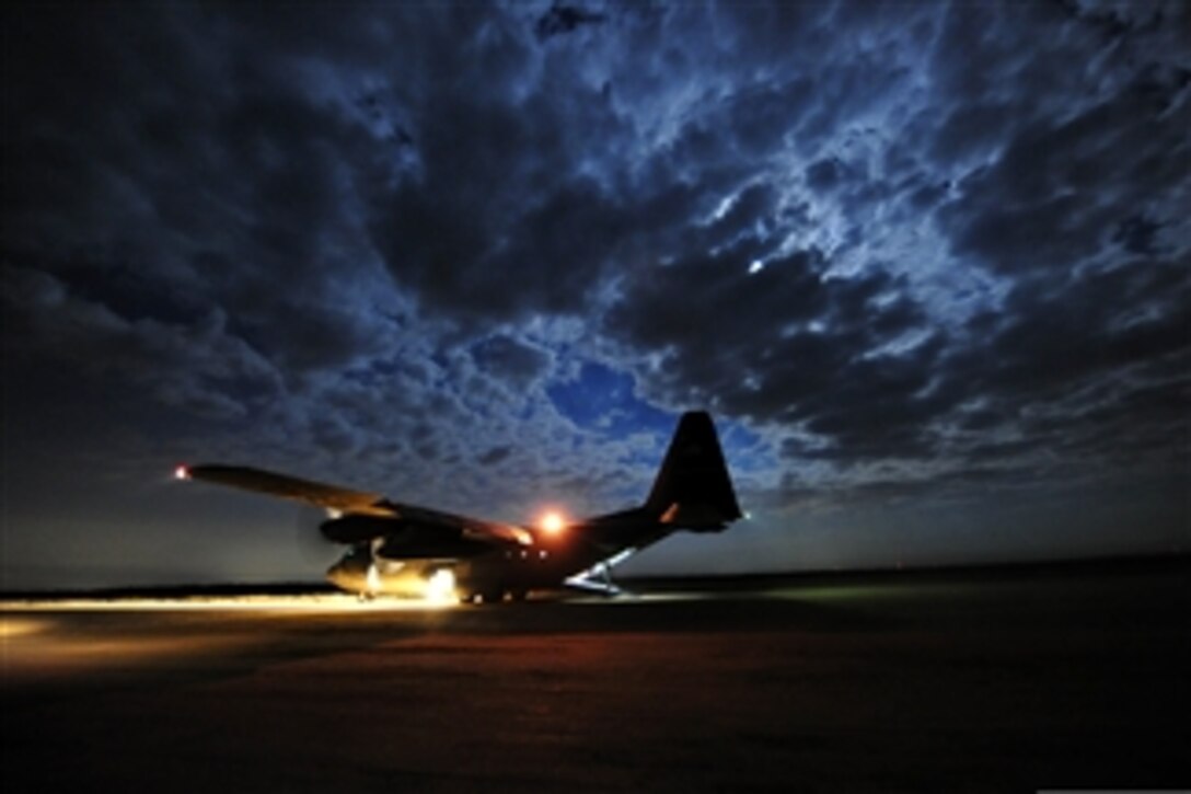 A U.S. Air Force C-130 Hercules pauses on the runaway during air mobility operations at Holland Drop Zone on Fort Bragg, N.C., on June 7, 2012.  The operations are part of Joint Operations Access Exercise 12-02, which is a two-week forcible entry and ground combat exercise to prepare Air Force and Army service members to respond to worldwide crises and contingencies.  