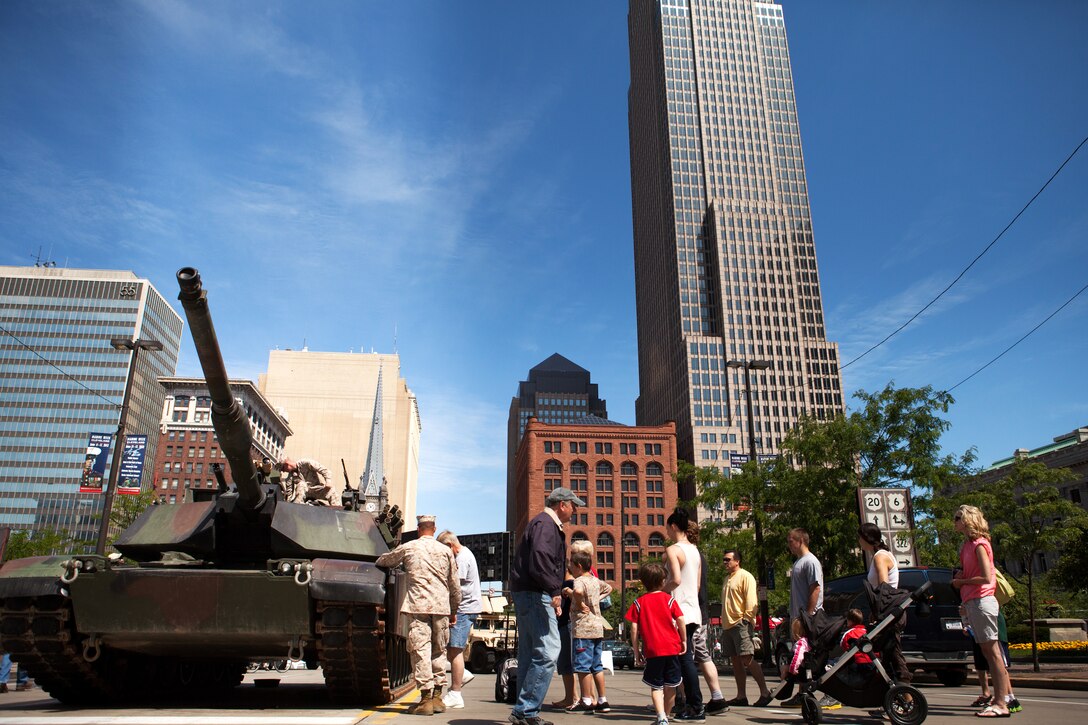 Clevelanders wait in line to go inside an M1A1 Abrams tank in Public Square in downtown Cleveland June 14, 2012. The tank was one of many static displays located in Public Square, Gateway Plaza, Voinovich Park and Rock and Roll Hall of Fame available for public viewing. The Marines manning the static displays here received lunch from Rabbi Jonathan Krainess during Marine Week Cleveland. (U.S. Marine Corps photo by Cpl. Chelsea Flowers/Released)