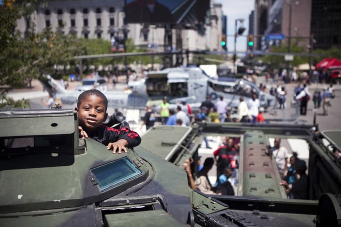 CLEVELANDâ??Manroe Hollie, Jr., 6, sits in a amphibious assualt vehicle parked at the Public Square here, June 14, 2012. Public Square is one of the sites of displays available for public during the Marine Week Cleveland. The Marine Week brings Marine Corps vehicles, aircraft and equipment for public viewing at venues such as Public Square, Voinovich Park, Gateway Plaza and Rock and Roll Hall of Fame. Marine Week Cleveland celebrates community, country and the Corps. More than 750 Marines journeyed to Cleveland for the event. Ohio has more than 9,000 active and reserve Marines, making it one of the top-five producers of Marines. The culminating event for the week is the Marine Air-Ground Task Force demo, June 16-17, in which Marines will invade the Burke Lakefront Airport by land, air, and sea. (U.S. Marine Corps Photo by Cpl. Marcin Platek)::r::::n::