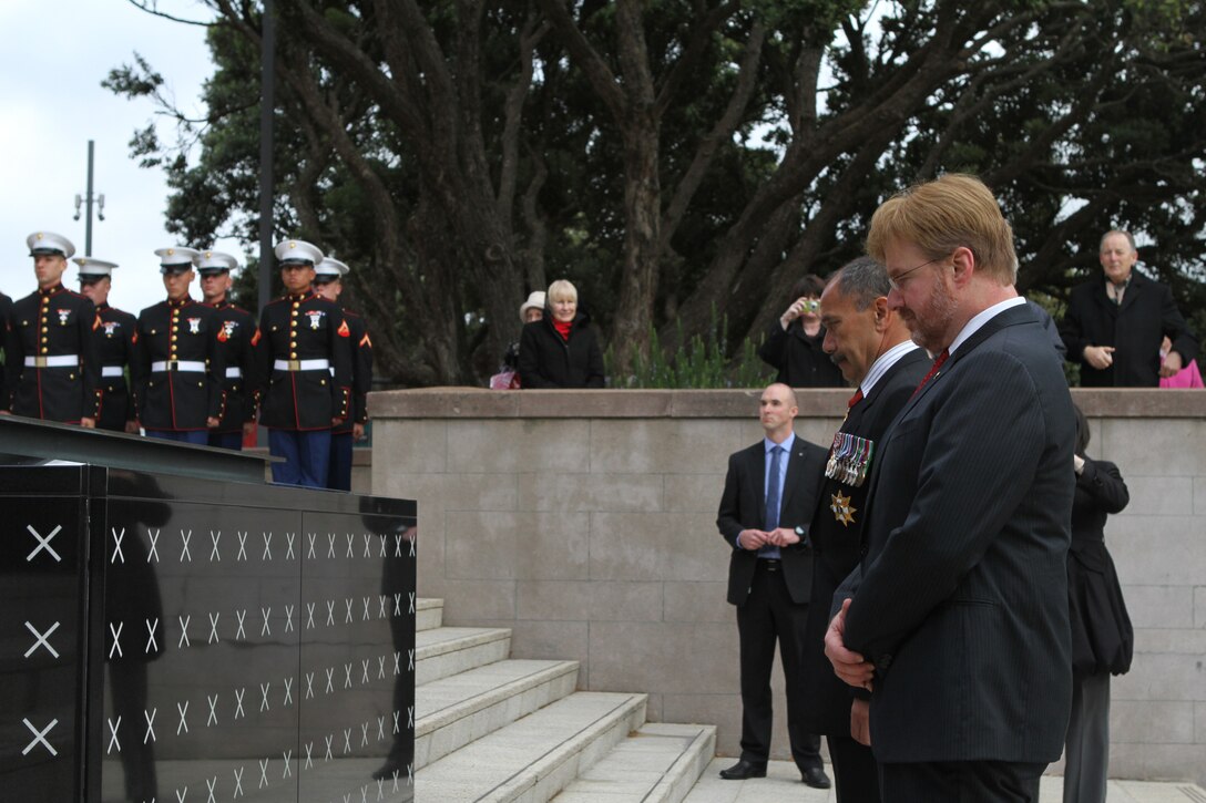 Sir Jerry Mateparae, Governor-General of New Zealand, and David Huebner, U.S. Ambassador to New Zealand, pay their respects at the foot of the Tomb of the Unknown Warrior at the National War Memorial here, June 14. Two squads of U.S. Marines from the 11th Marine Regiment stood guard at the foot of the ceremony during the arrival of the official guests, including New Zealand Prime Minister John Key. Government and military officials of the United States and New Zealand commemorated the 70th anniversary of the arrival of U.S. forces in Wellington during World War II. Australian and New Zealand forces were conducting heavy fighting in North Africa in 1942 while U.S. forces played a significant role in the defense of Oceania.::r::::n::(U.S. Marine Corps photo by Sgt. Jacob H. Harrer)::r::::n::
