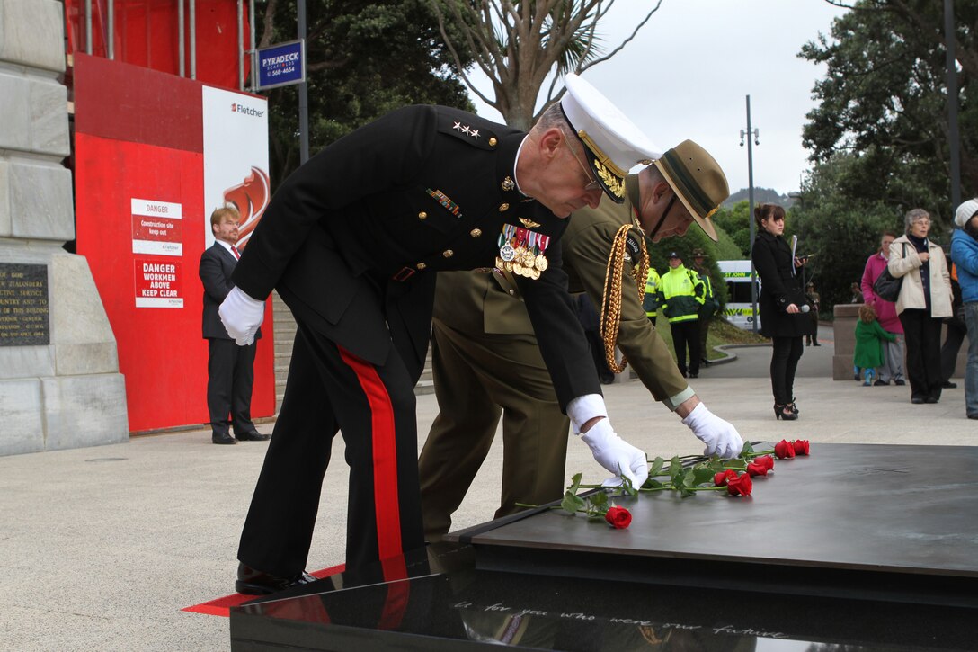 Lieutenant General Duane D. Thiessen, the Commanding General of U.S. Marine Corps Forces Pacific, and Lt. Gen. Rhys Jones, Chief of the New Zealand Defense Force, lay roses on the Tomb of the Unknown Soldier during a commemoration ceremony here, June 14. Government and military officials of the United States and New Zealand commemorated the 70th anniversary of the arrival of U.S. forces in Wellington during World War II. Australian and New Zealand forces were conducting heavy fighting in Northern Africa in 1942 while U.S. forces played a significant role in the defense of Oceania.::r::::n::(U.S. Marine Corps photo by Sgt. Jacob H. Harrer)::r::::n::
