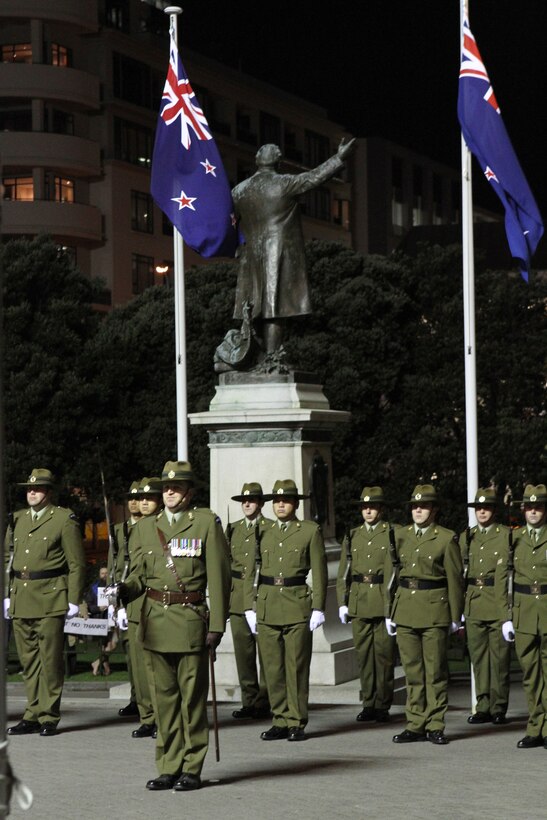 New Zealand Army Soldiers from the 25th Engineer Support Squadron post as the ceremonial guard during the sunset ceremony with U.S. Marines at the Parliament House here, June 14. Government and military officials of the United States and New Zealand commemorated the 70th anniversary of the arrival of U.S. forces in Wellington during World War II. Australian and New Zealand forces were conducting heavy fighting in Northern Africa in 1942 while U.S. forces played a significant role in the defense of Oceania.::r::::n::(U.S. Marine Corps photo by Sgt. Jacob H. Harrer)::r::::n::