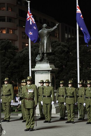 New Zealand Army Soldiers from the 25th Engineer Support Squadron post as the ceremonial guard during the sunset ceremony with U.S. Marines at the Parliament House here, June 14. Government and military officials of the United States and New Zealand commemorated the 70th anniversary of the arrival of U.S. forces in Wellington during World War II. Australian and New Zealand forces were conducting heavy fighting in Northern Africa in 1942 while U.S. forces played a significant role in the defense of Oceania.::r::::n::(U.S. Marine Corps photo by Sgt. Jacob H. Harrer)::r::::n::
