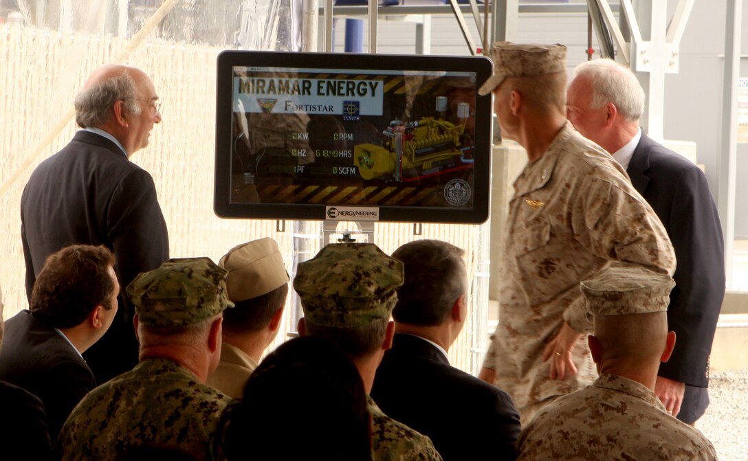 Mark Comora, president of Fortistar LLC, Col. Frank A. Richie, commanding officer of Marine Corps Air Station Miramar and the Honorable Jerry Sanders, mayor of San Diego, monitor a generator’s start-up progress during the opening ceremony for the Miramar Energy Project aboard MCAS Miramar June 14. The project is a joint venture between the City of San Diego, Fortistar LLC and the air station and reduces greenhouse gas emissions, reduces the energy load on the local grid and moves the air station in the direction of energy independence.