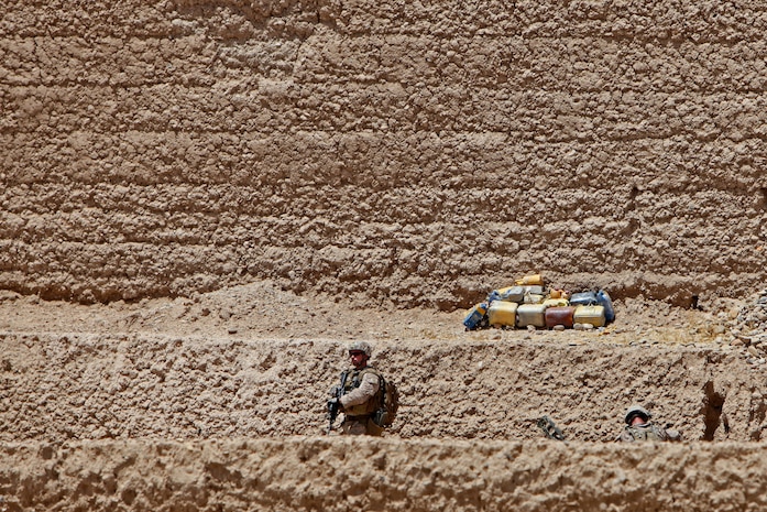 Benjamin, a rising eighth-grader at Quantico/Middle High School, snaps a photo of a weight-bearing tower during Quantico’s Science, Technology, Engineering and Mathematics Academy on Friday. During the competition, weight was applied to the students’ hand-built balsa wood towers to determine which tower had the highest strength-to-weight ratio.