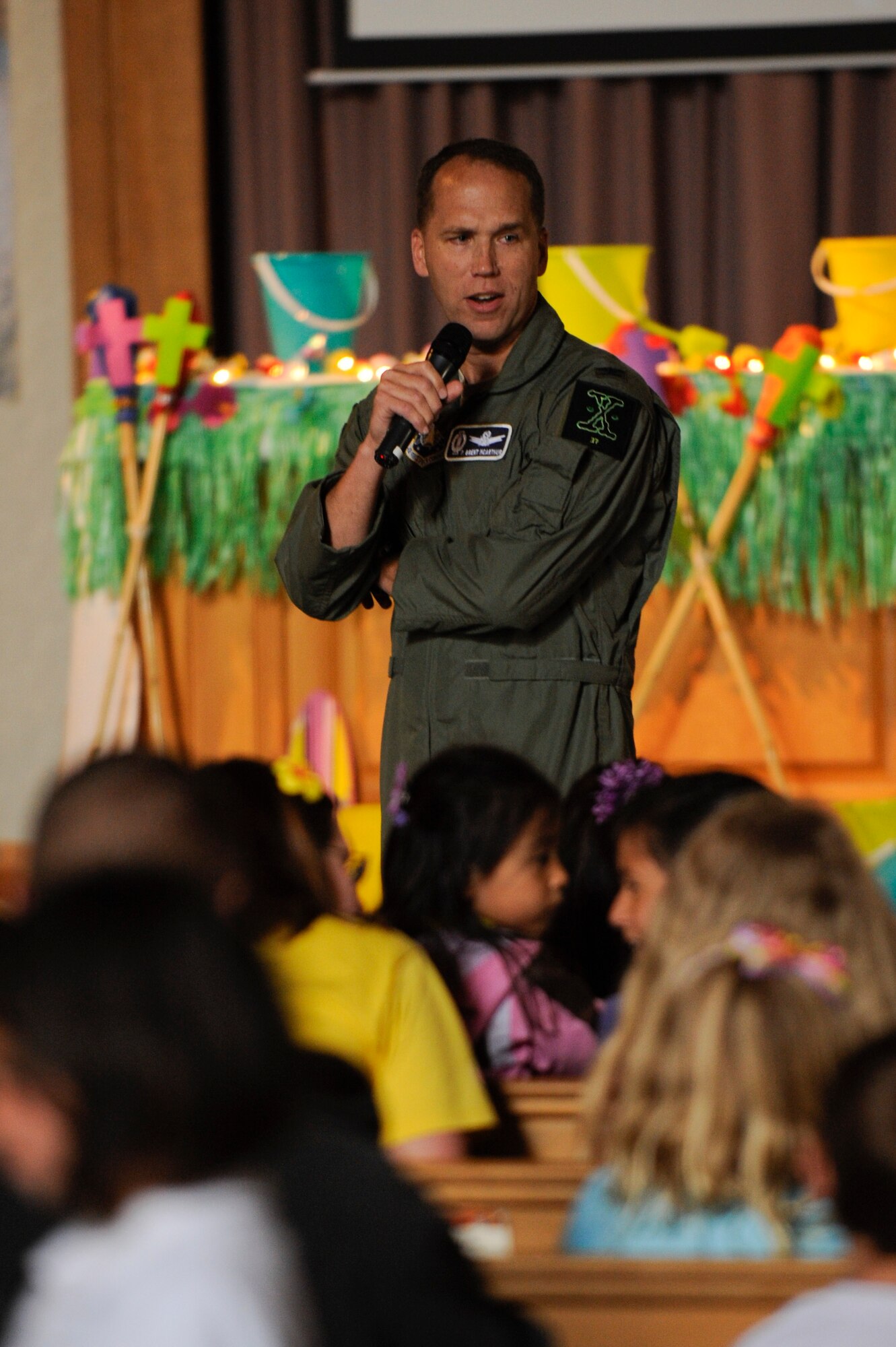 VANDENBERG AIR FORCE BASE, Calif.-- Col. Brent McArthur, 30th Space Wing vice commander, gives closing remarks at the Vacation Bible School hosted by the 30th Space Wing Chapel staff here Friday, June 15, 2012. The school is in their tenth year of operation, teaching 140 students in five different classes with the help of more than 50 base volunteers. (U.S. Air Force photo/Staff Sgt. Levi Riendeau)