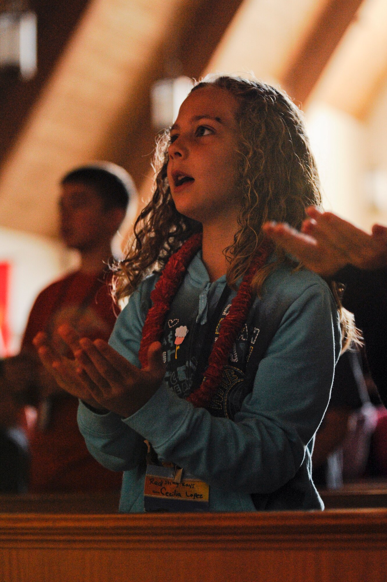 VANDENBERG AIR FORCE BASE, Calif. -- Cecillia Lopez, daughter of Staff Sgt. Marcos Lopez, a 30th Civil Engineer Squadron member, and Sarah Lopez, sings and dances at Vacation Bible School hosted by the 30th Space Wing Chapel staff here Friday, June 15, 2012. The school is in their tenth year of operation, teaching 140 students in five different classes with the help of more than 50 base volunteers. (U.S. Air Force photo/Staff Sgt. Levi Riendeau)